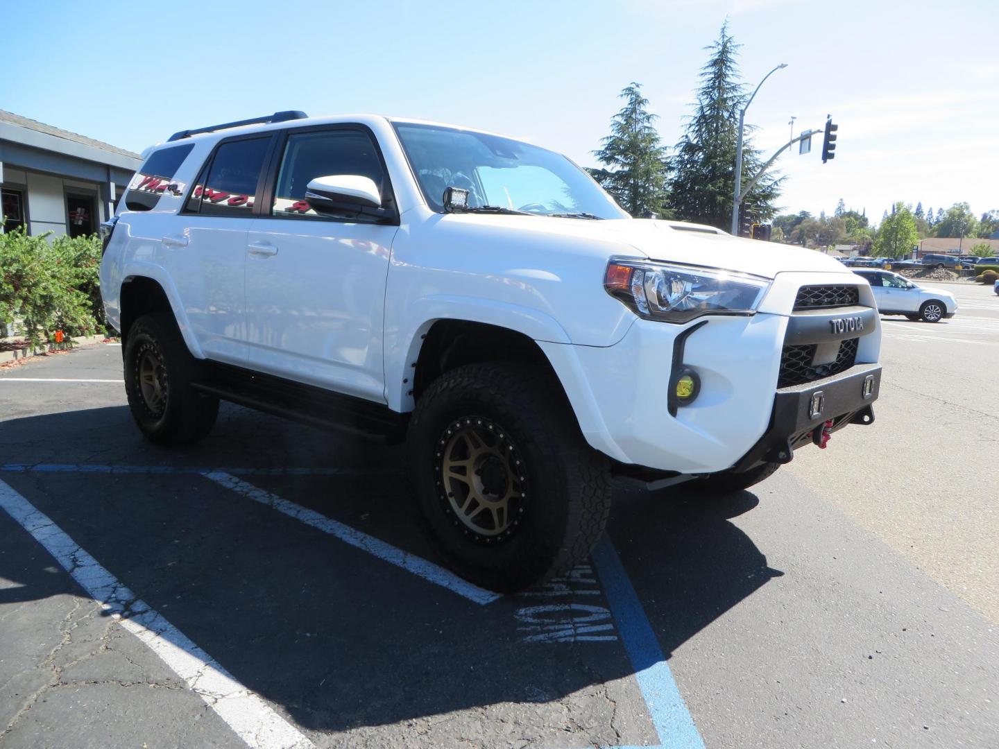 2021 White Toyota 4Runner TRD Off-road Premium 4WD (JTERU5JR5M5) with an 4.0L V6 DOHC 24V engine, 5A transmission, located at 2630 Grass Valley Highway, Auburn, CA, 95603, (530) 508-5100, 38.937893, -121.095482 - TRD Offroad Premium 4Runner ready for all of your adventures. Features Ironman suspension, 285 Falken Wildpeak AT3W tires, 17" Method Race wheels, Front winch bumper, Badlands winch, Led bumper and ditch lights, and rear cargo molle panels. - Photo#6
