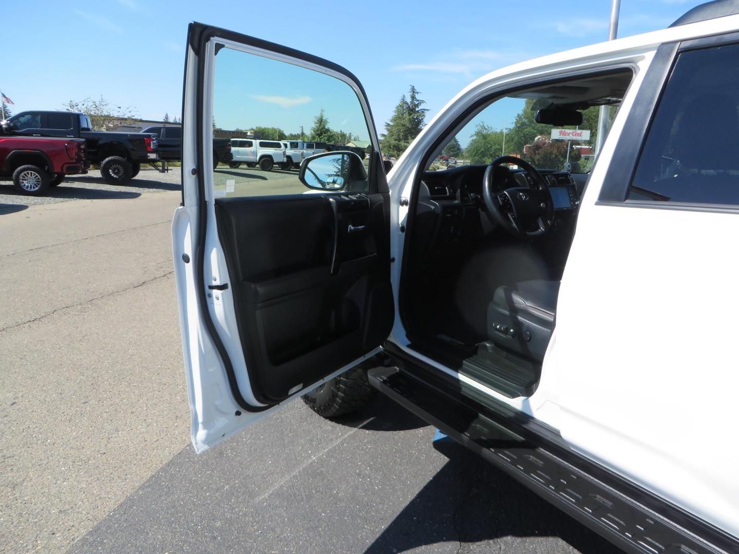 2021 White Toyota 4Runner TRD Off-road Premium 4WD (JTERU5JR5M5) with an 4.0L V6 DOHC 24V engine, 5A transmission, located at 2630 Grass Valley Highway, Auburn, CA, 95603, (530) 508-5100, 38.937893, -121.095482 - TRD Offroad Premium 4Runner ready for all of your adventures. Features Ironman suspension, 285 Falken Wildpeak AT3W tires, 17" Method Race wheels, Front winch bumper, Badlands winch, Led bumper and ditch lights, and rear cargo molle panels. - Photo#16