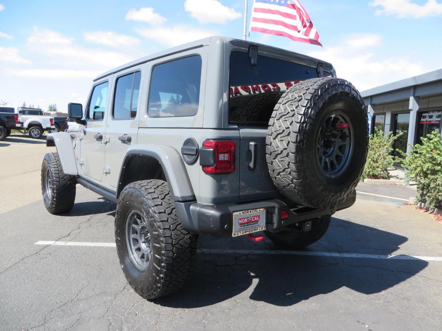 2021 Gray Jeep Wrangler Unlimited Rubicon (1C4HJXFN3MW) with an 2.0L L4 DOHC 16V TURBO engine, 6A transmission, located at 2630 Grass Valley Highway, Auburn, CA, 95603, (530) 508-5100, 38.937893, -121.095482 - Mopar lifted Rubicon, Fox shocks, 17" Method race wheels, 37" Nitto Recon Grappler tires, Falcon steering stabilizer, Smittybilt HD spare tire carrier, and Weathertech 1st and 2nd row floor liners. - Photo#2