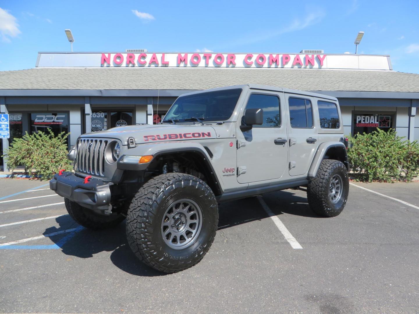 2021 Gray Jeep Wrangler Unlimited Rubicon (1C4HJXFN3MW) with an 2.0L L4 DOHC 16V TURBO engine, 6A transmission, located at 2630 Grass Valley Highway, Auburn, CA, 95603, (530) 508-5100, 38.937893, -121.095482 - Mopar lifted Rubicon, Fox shocks, 17" Method race wheels, 37" Nitto Recon Grappler tires, Falcon steering stabilizer, Smittybilt HD spare tire carrier, and Weathertech 1st and 2nd row floor liners. - Photo#0