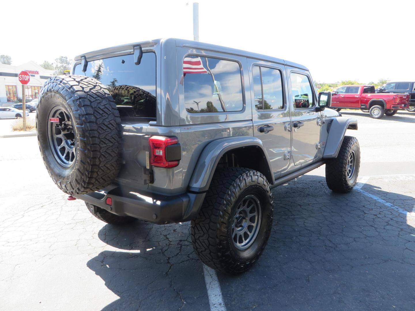 2021 Gray Jeep Wrangler Unlimited Rubicon (1C4HJXFN3MW) with an 2.0L L4 DOHC 16V TURBO engine, 6A transmission, located at 2630 Grass Valley Highway, Auburn, CA, 95603, (530) 508-5100, 38.937893, -121.095482 - Mopar lifted Rubicon, Fox shocks, 17" Method race wheels, 37" Nitto Recon Grappler tires, Falcon steering stabilizer, Smittybilt HD spare tire carrier, and Weathertech 1st and 2nd row floor liners. - Photo#4