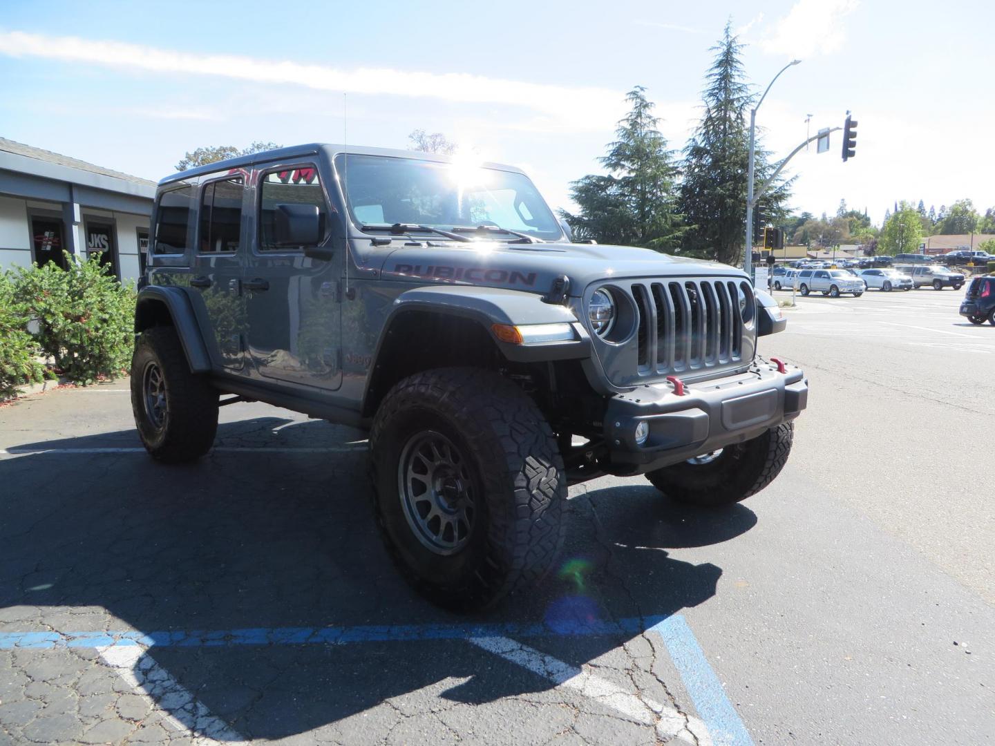 2021 Gray Jeep Wrangler Unlimited Rubicon (1C4HJXFN3MW) with an 2.0L L4 DOHC 16V TURBO engine, 6A transmission, located at 2630 Grass Valley Highway, Auburn, CA, 95603, (530) 508-5100, 38.937893, -121.095482 - Mopar lifted Rubicon, Fox shocks, 17" Method race wheels, 37" Nitto Recon Grappler tires, Falcon steering stabilizer, Smittybilt HD spare tire carrier, and Weathertech 1st and 2nd row floor liners. - Photo#6