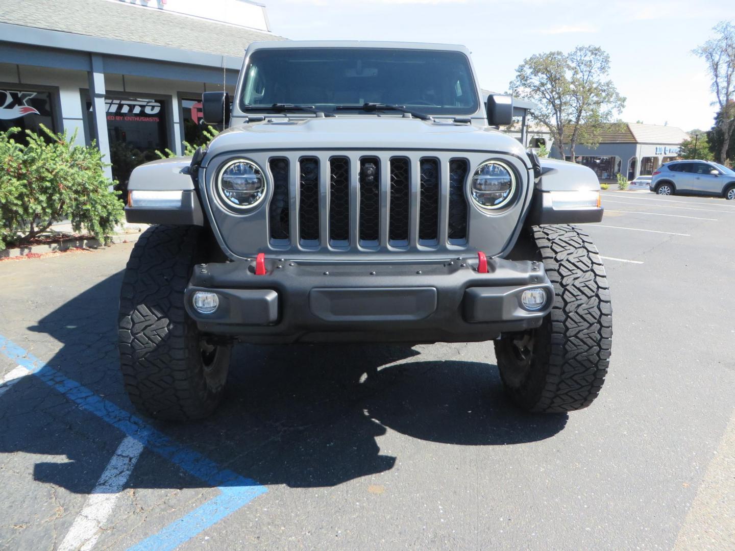 2021 Gray Jeep Wrangler Unlimited Rubicon (1C4HJXFN3MW) with an 2.0L L4 DOHC 16V TURBO engine, 6A transmission, located at 2630 Grass Valley Highway, Auburn, CA, 95603, (530) 508-5100, 38.937893, -121.095482 - Mopar lifted Rubicon, Fox shocks, 17" Method race wheels, 37" Nitto Recon Grappler tires, Falcon steering stabilizer, Smittybilt HD spare tire carrier, and Weathertech 1st and 2nd row floor liners. - Photo#7