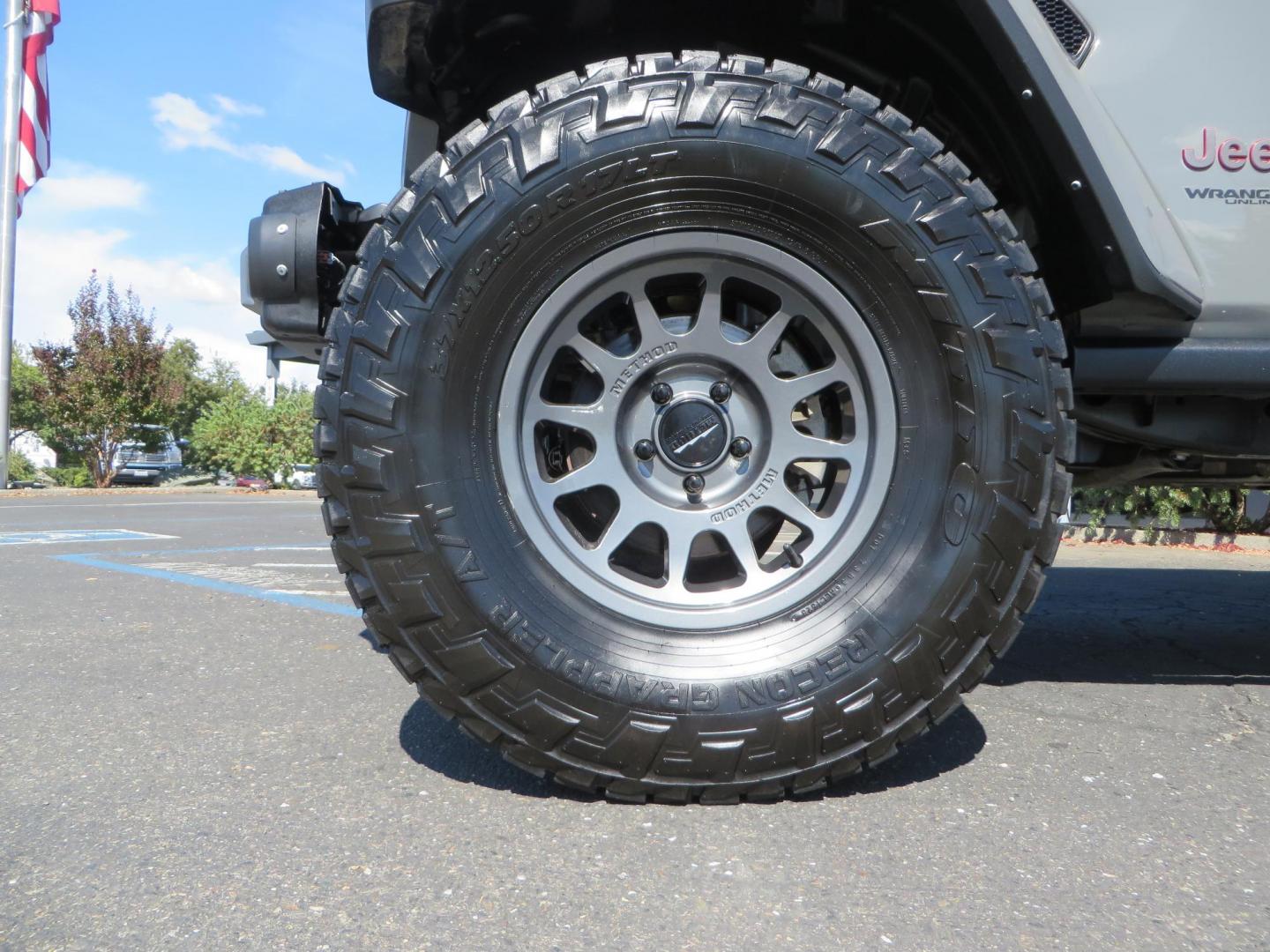 2021 Gray Jeep Wrangler Unlimited Rubicon (1C4HJXFN3MW) with an 2.0L L4 DOHC 16V TURBO engine, 6A transmission, located at 2630 Grass Valley Highway, Auburn, CA, 95603, (530) 508-5100, 38.937893, -121.095482 - Mopar lifted Rubicon, Fox shocks, 17" Method race wheels, 37" Nitto Recon Grappler tires, Falcon steering stabilizer, Smittybilt HD spare tire carrier, and Weathertech 1st and 2nd row floor liners. - Photo#8
