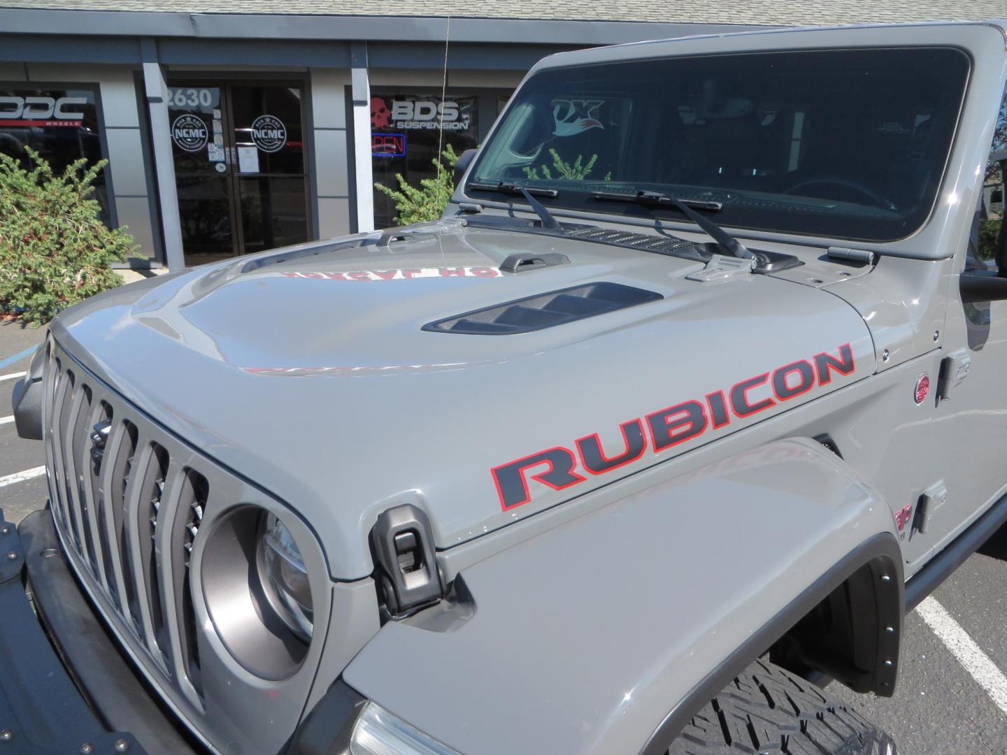 2021 Gray Jeep Wrangler Unlimited Rubicon (1C4HJXFN3MW) with an 2.0L L4 DOHC 16V TURBO engine, 6A transmission, located at 2630 Grass Valley Highway, Auburn, CA, 95603, (530) 508-5100, 38.937893, -121.095482 - Mopar lifted Rubicon, Fox shocks, 17" Method race wheels, 37" Nitto Recon Grappler tires, Falcon steering stabilizer, Smittybilt HD spare tire carrier, and Weathertech 1st and 2nd row floor liners. - Photo#12