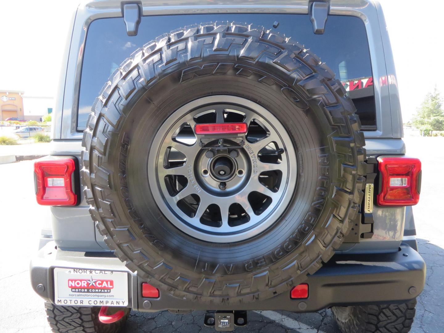 2021 Gray Jeep Wrangler Unlimited Rubicon (1C4HJXFN3MW) with an 2.0L L4 DOHC 16V TURBO engine, 6A transmission, located at 2630 Grass Valley Highway, Auburn, CA, 95603, (530) 508-5100, 38.937893, -121.095482 - Mopar lifted Rubicon, Fox shocks, 17" Method race wheels, 37" Nitto Recon Grappler tires, Falcon steering stabilizer, Smittybilt HD spare tire carrier, and Weathertech 1st and 2nd row floor liners. - Photo#13