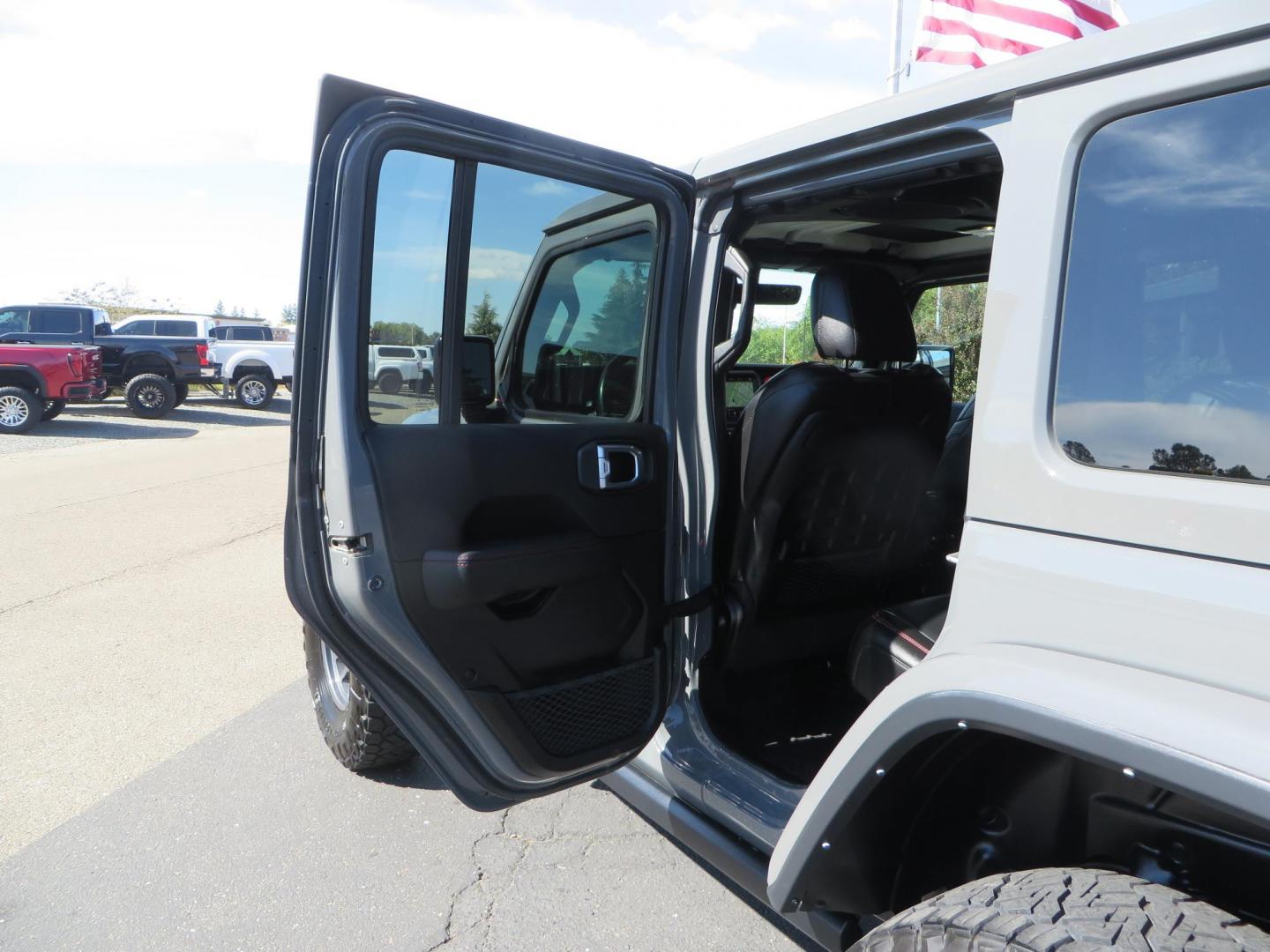 2021 Gray Jeep Wrangler Unlimited Rubicon (1C4HJXFN3MW) with an 2.0L L4 DOHC 16V TURBO engine, 6A transmission, located at 2630 Grass Valley Highway, Auburn, CA, 95603, (530) 508-5100, 38.937893, -121.095482 - Mopar lifted Rubicon, Fox shocks, 17" Method race wheels, 37" Nitto Recon Grappler tires, Falcon steering stabilizer, Smittybilt HD spare tire carrier, and Weathertech 1st and 2nd row floor liners. - Photo#42