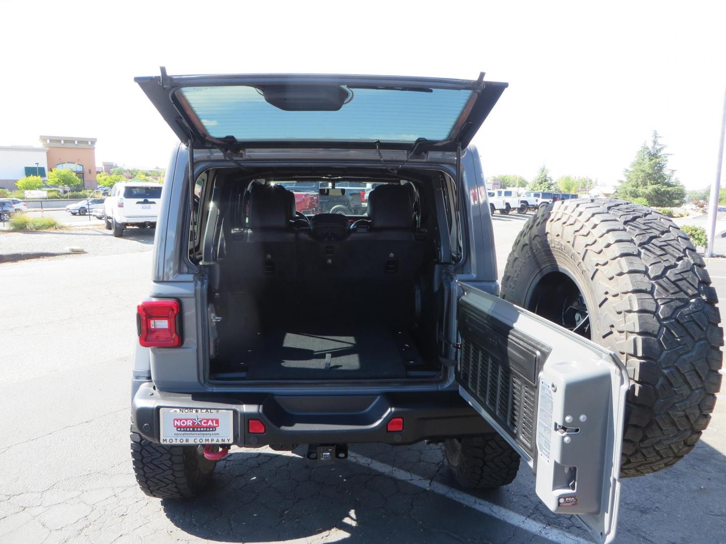 2021 Gray Jeep Wrangler Unlimited Rubicon (1C4HJXFN3MW) with an 2.0L L4 DOHC 16V TURBO engine, 6A transmission, located at 2630 Grass Valley Highway, Auburn, CA, 95603, (530) 508-5100, 38.937893, -121.095482 - Mopar lifted Rubicon, Fox shocks, 17" Method race wheels, 37" Nitto Recon Grappler tires, Falcon steering stabilizer, Smittybilt HD spare tire carrier, and Weathertech 1st and 2nd row floor liners. - Photo#63