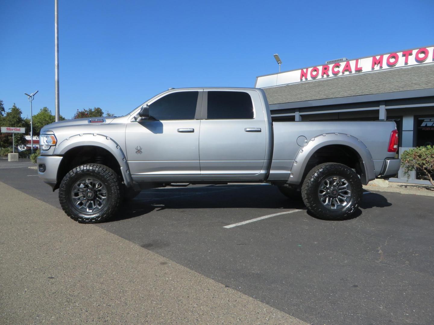 2022 SILVER /Black RAM 2500 Big Horn Black Widow Edition Crew Cab 4WD (3C6UR5DL3NG) with an 6.7L L6 OHV 24V TURBO DIESEL engine, 6A transmission, located at 2630 Grass Valley Highway, Auburn, CA, 95603, (530) 508-5100, 38.937893, -121.095482 - Ram 2500 Black Widow Edition Features 5" Suspension Lift System 20" Black Off Road Wheels 37" BFG KM3 Mud Terrain Tires Color Matched Pocket Fender Flares AMP Power Running Boards Tinted Front Windows Black Widow Gauge Cluster Black Widow Custom Stitched Headrests Red LED Interior Lights P - Photo#1