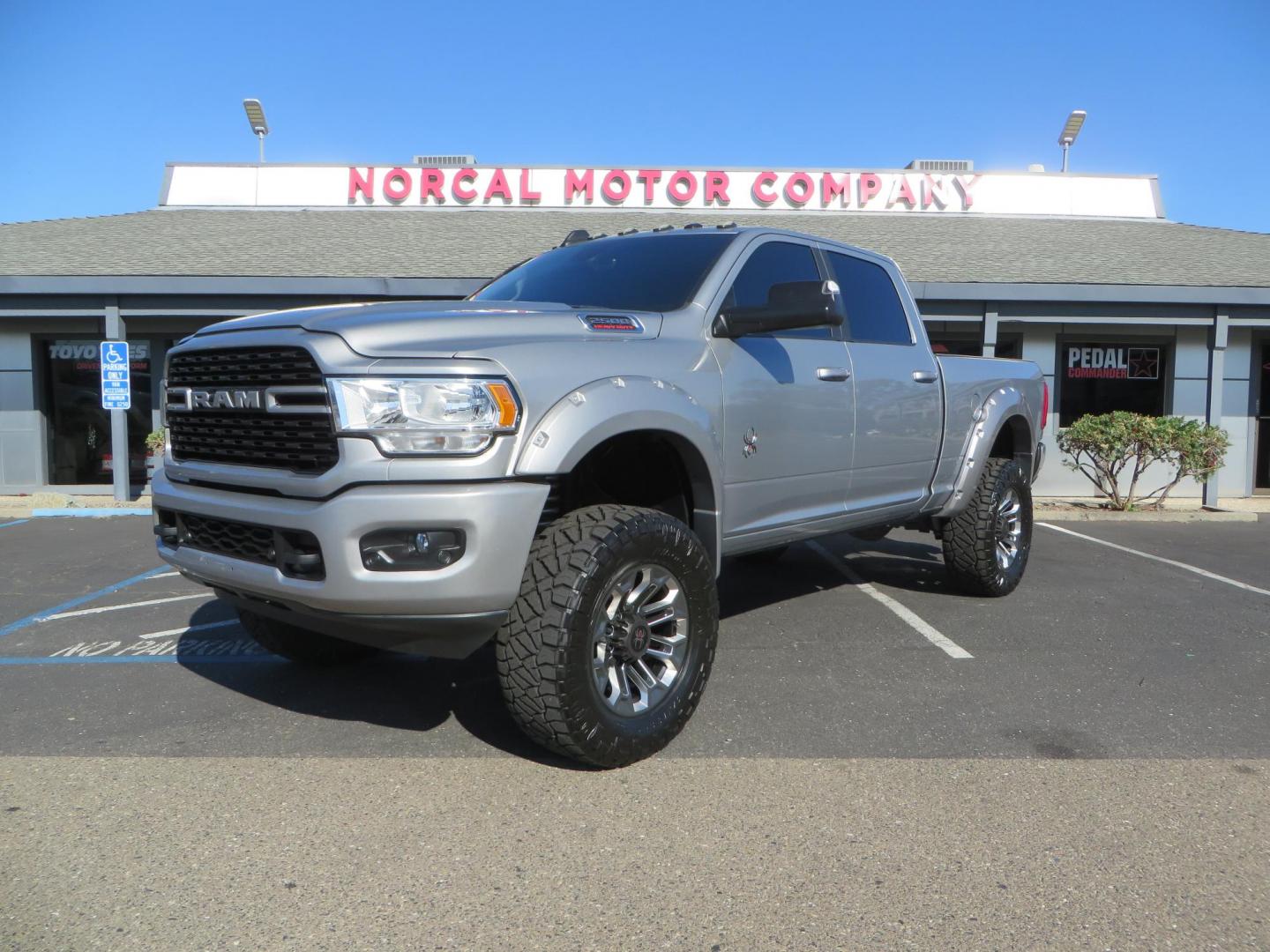 2022 SILVER /Black RAM 2500 Big Horn Black Widow Edition Crew Cab 4WD (3C6UR5DL3NG) with an 6.7L L6 OHV 24V TURBO DIESEL engine, 6A transmission, located at 2630 Grass Valley Highway, Auburn, CA, 95603, (530) 508-5100, 38.937893, -121.095482 - Ram 2500 Black Widow Edition Features 5" Suspension Lift System 20" Black Off Road Wheels 37" BFG KM3 Mud Terrain Tires Color Matched Pocket Fender Flares AMP Power Running Boards Tinted Front Windows Black Widow Gauge Cluster Black Widow Custom Stitched Headrests Red LED Interior Lights P - Photo#0