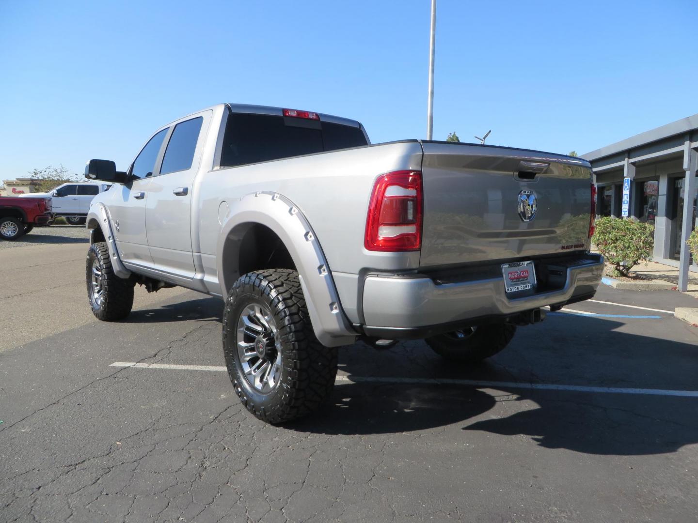2022 SILVER /Black RAM 2500 Big Horn Black Widow Edition Crew Cab 4WD (3C6UR5DL3NG) with an 6.7L L6 OHV 24V TURBO DIESEL engine, 6A transmission, located at 2630 Grass Valley Highway, Auburn, CA, 95603, (530) 508-5100, 38.937893, -121.095482 - Ram 2500 Black Widow Edition Features 5" Suspension Lift System 20" Black Off Road Wheels 37" BFG KM3 Mud Terrain Tires Color Matched Pocket Fender Flares AMP Power Running Boards Tinted Front Windows Black Widow Gauge Cluster Black Widow Custom Stitched Headrests Red LED Interior Lights P - Photo#2