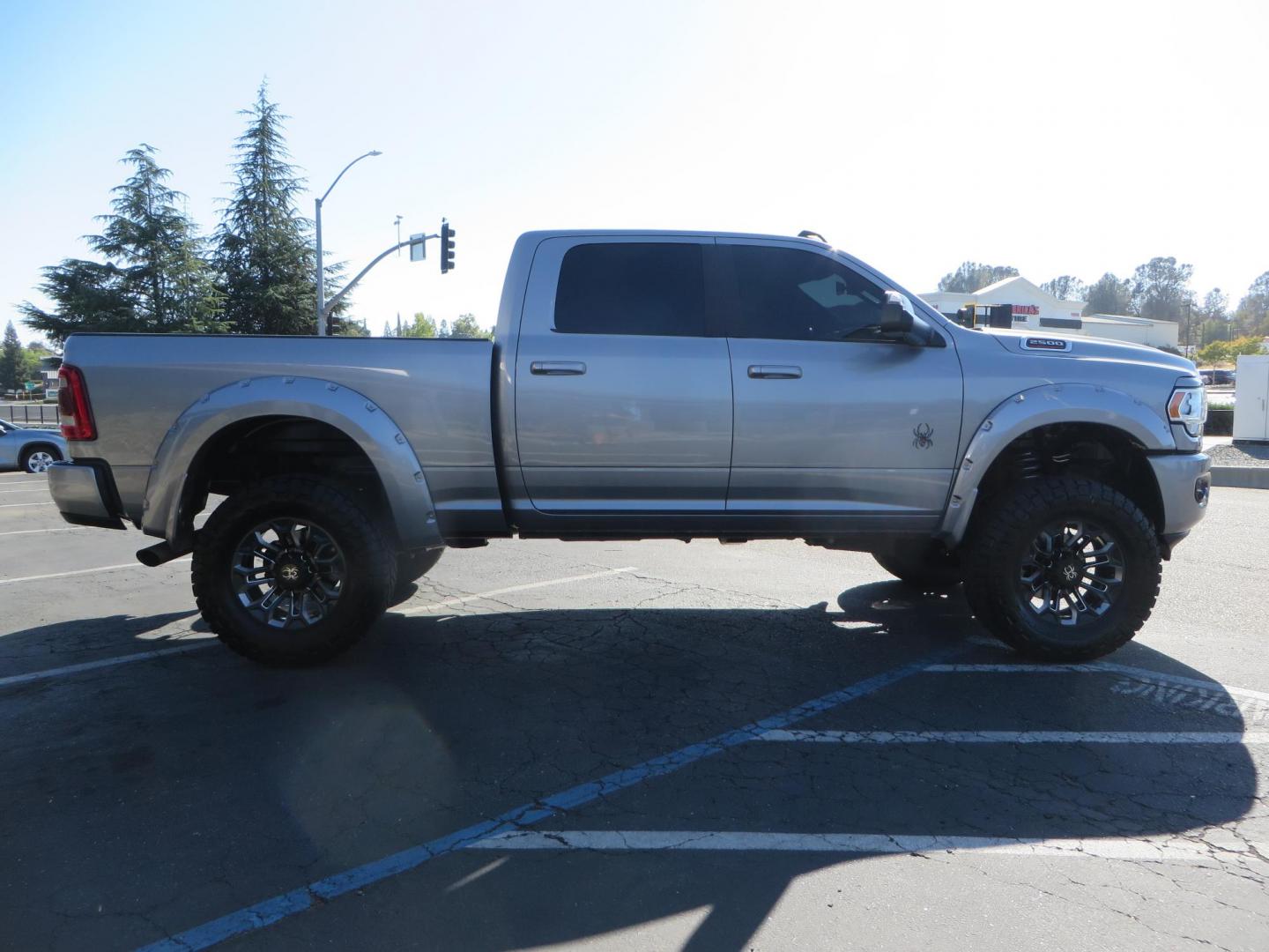 2022 SILVER /Black RAM 2500 Big Horn Black Widow Edition Crew Cab 4WD (3C6UR5DL3NG) with an 6.7L L6 OHV 24V TURBO DIESEL engine, 6A transmission, located at 2630 Grass Valley Highway, Auburn, CA, 95603, (530) 508-5100, 38.937893, -121.095482 - Ram 2500 Black Widow Edition Features 5" Suspension Lift System 20" Black Off Road Wheels 37" BFG KM3 Mud Terrain Tires Color Matched Pocket Fender Flares AMP Power Running Boards Tinted Front Windows Black Widow Gauge Cluster Black Widow Custom Stitched Headrests Red LED Interior Lights P - Photo#5