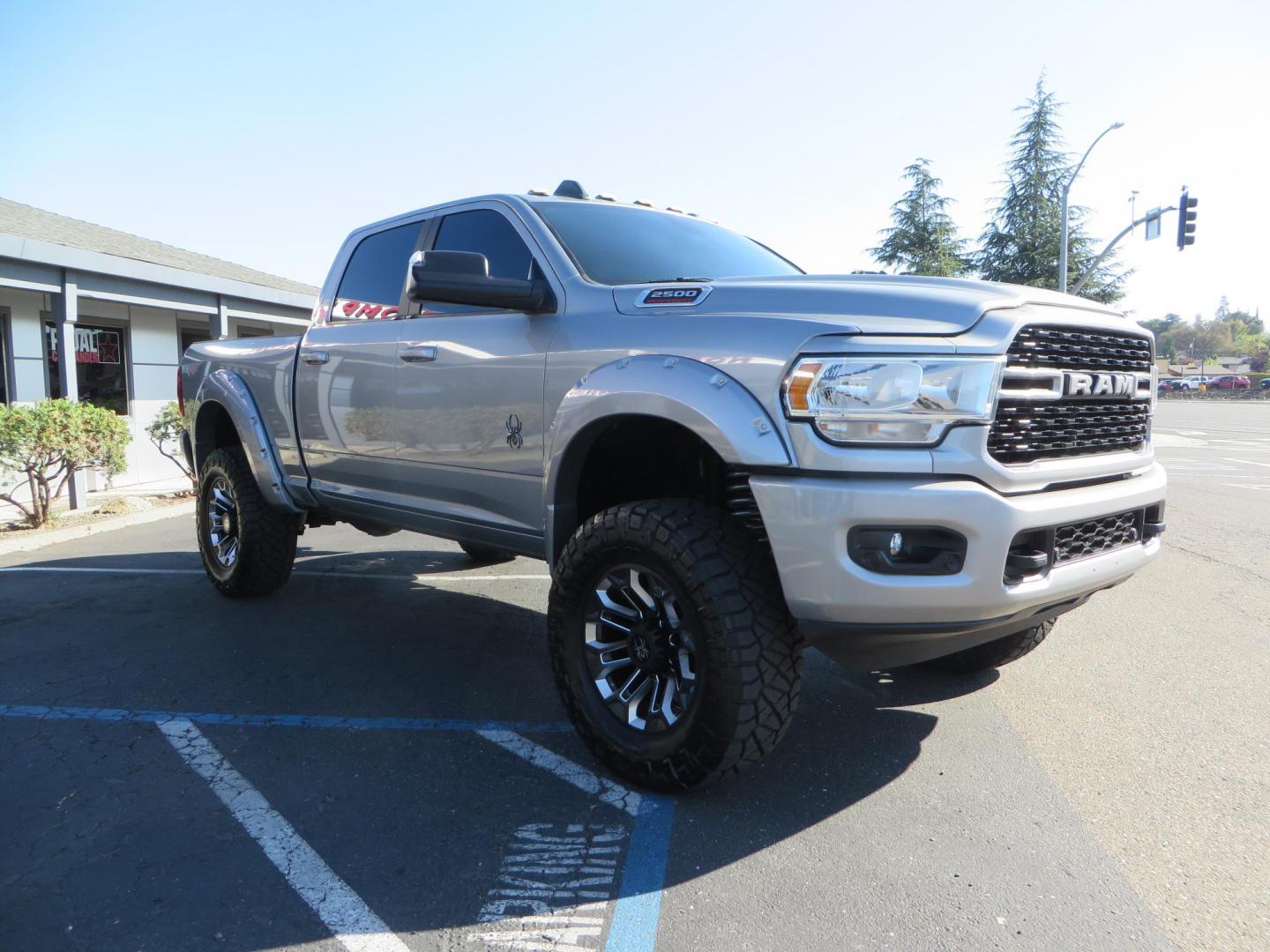 2022 SILVER /Black RAM 2500 Big Horn Black Widow Edition Crew Cab 4WD (3C6UR5DL3NG) with an 6.7L L6 OHV 24V TURBO DIESEL engine, 6A transmission, located at 2630 Grass Valley Highway, Auburn, CA, 95603, (530) 508-5100, 38.937893, -121.095482 - Ram 2500 Black Widow Edition Features 5" Suspension Lift System 20" Black Off Road Wheels 37" BFG KM3 Mud Terrain Tires Color Matched Pocket Fender Flares AMP Power Running Boards Tinted Front Windows Black Widow Gauge Cluster Black Widow Custom Stitched Headrests Red LED Interior Lights P - Photo#6