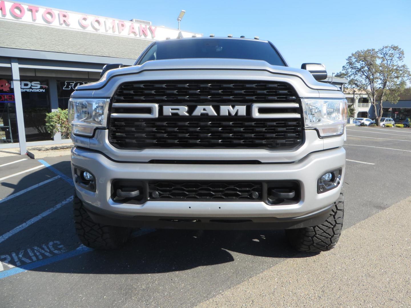 2022 SILVER /Black RAM 2500 Big Horn Black Widow Edition Crew Cab 4WD (3C6UR5DL3NG) with an 6.7L L6 OHV 24V TURBO DIESEL engine, 6A transmission, located at 2630 Grass Valley Highway, Auburn, CA, 95603, (530) 508-5100, 38.937893, -121.095482 - Ram 2500 Black Widow Edition Features 5" Suspension Lift System 20" Black Off Road Wheels 37" BFG KM3 Mud Terrain Tires Color Matched Pocket Fender Flares AMP Power Running Boards Tinted Front Windows Black Widow Gauge Cluster Black Widow Custom Stitched Headrests Red LED Interior Lights P - Photo#7