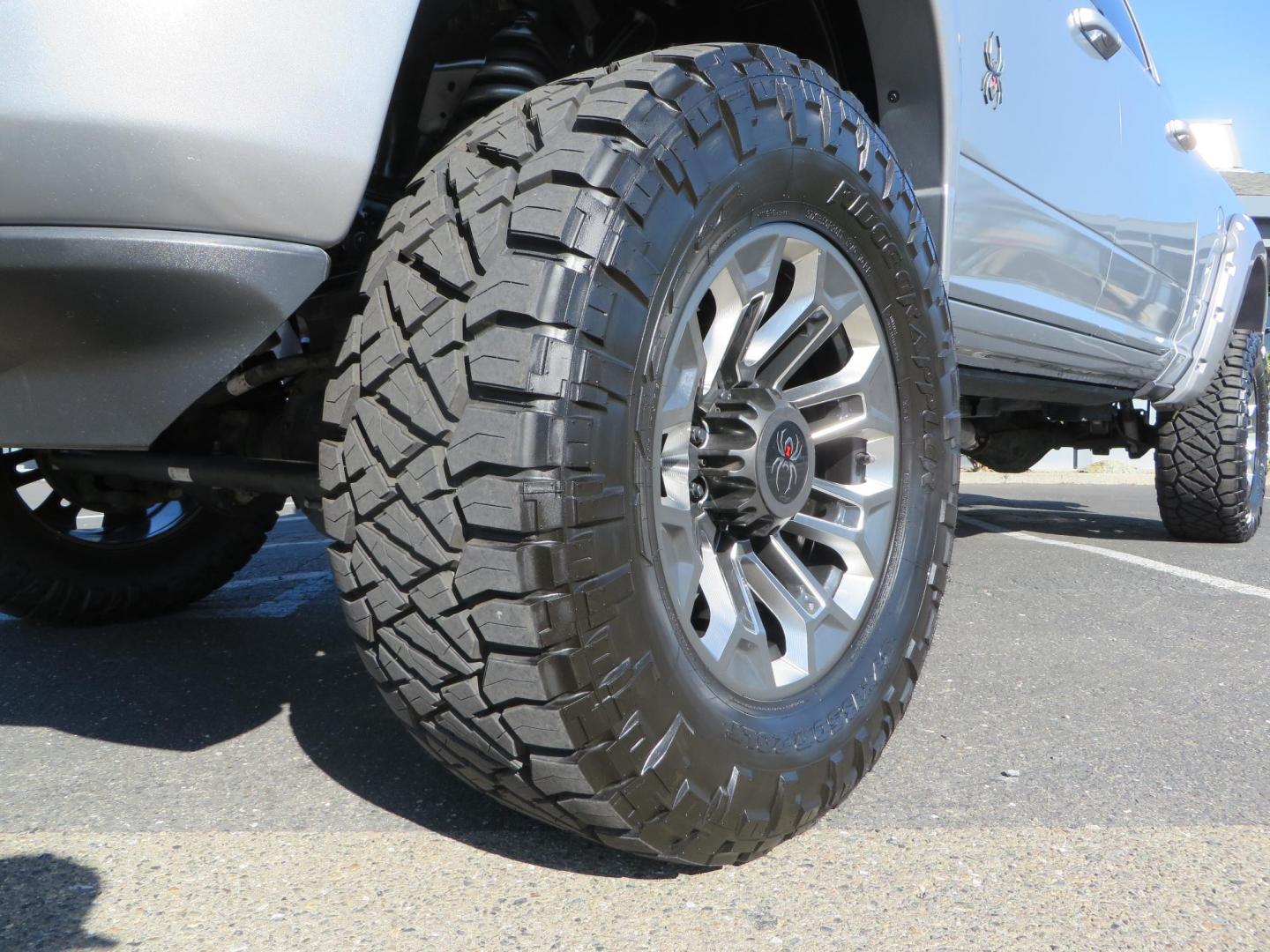 2022 SILVER /Black RAM 2500 Big Horn Black Widow Edition Crew Cab 4WD (3C6UR5DL3NG) with an 6.7L L6 OHV 24V TURBO DIESEL engine, 6A transmission, located at 2630 Grass Valley Highway, Auburn, CA, 95603, (530) 508-5100, 38.937893, -121.095482 - Ram 2500 Black Widow Edition Features 5" Suspension Lift System 20" Black Off Road Wheels 37" BFG KM3 Mud Terrain Tires Color Matched Pocket Fender Flares AMP Power Running Boards Tinted Front Windows Black Widow Gauge Cluster Black Widow Custom Stitched Headrests Red LED Interior Lights P - Photo#9