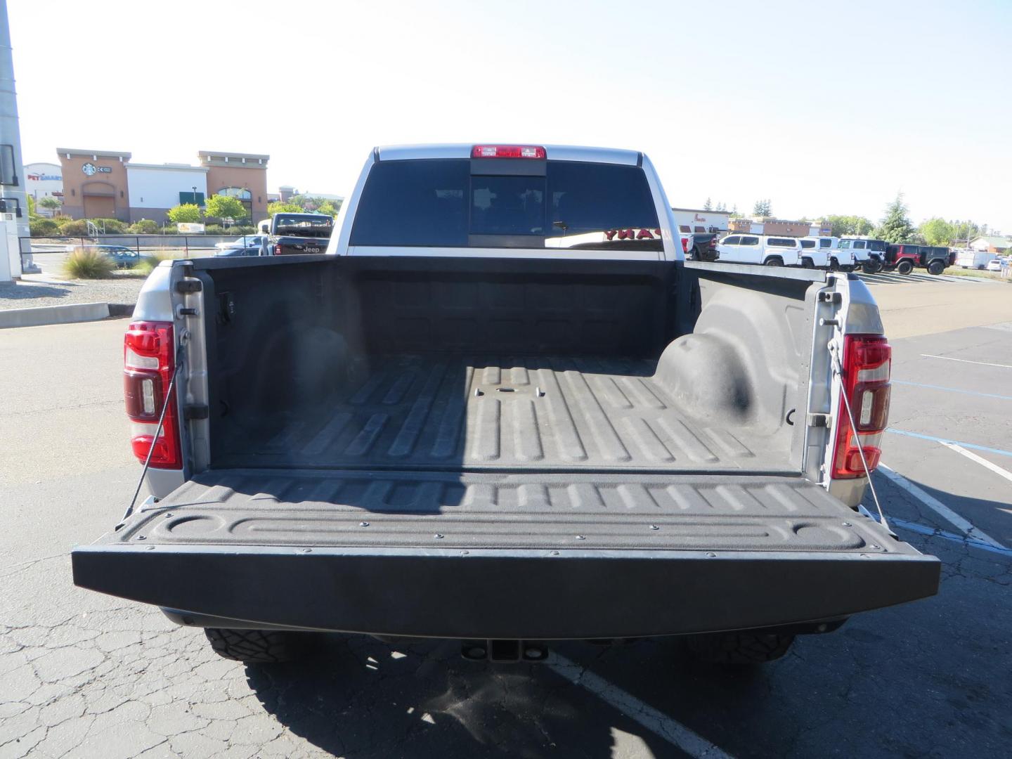 2022 SILVER /Black RAM 2500 Big Horn Black Widow Edition Crew Cab 4WD (3C6UR5DL3NG) with an 6.7L L6 OHV 24V TURBO DIESEL engine, 6A transmission, located at 2630 Grass Valley Highway, Auburn, CA, 95603, (530) 508-5100, 38.937893, -121.095482 - Ram 2500 Black Widow Edition Features 5" Suspension Lift System 20" Black Off Road Wheels 37" BFG KM3 Mud Terrain Tires Color Matched Pocket Fender Flares AMP Power Running Boards Tinted Front Windows Black Widow Gauge Cluster Black Widow Custom Stitched Headrests Red LED Interior Lights P - Photo#16