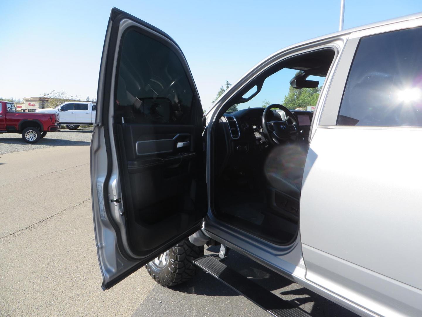 2022 SILVER /Black RAM 2500 Big Horn Black Widow Edition Crew Cab 4WD (3C6UR5DL3NG) with an 6.7L L6 OHV 24V TURBO DIESEL engine, 6A transmission, located at 2630 Grass Valley Highway, Auburn, CA, 95603, (530) 508-5100, 38.937893, -121.095482 - Ram 2500 Black Widow Edition Features 5" Suspension Lift System 20" Black Off Road Wheels 37" BFG KM3 Mud Terrain Tires Color Matched Pocket Fender Flares AMP Power Running Boards Tinted Front Windows Black Widow Gauge Cluster Black Widow Custom Stitched Headrests Red LED Interior Lights P - Photo#20