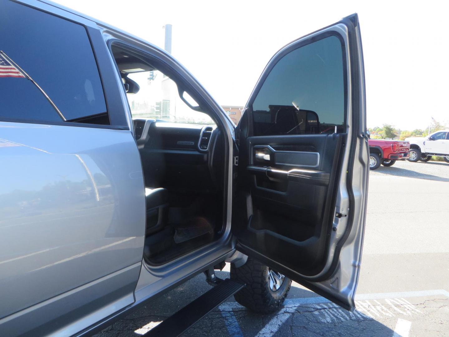 2022 SILVER /Black RAM 2500 Big Horn Black Widow Edition Crew Cab 4WD (3C6UR5DL3NG) with an 6.7L L6 OHV 24V TURBO DIESEL engine, 6A transmission, located at 2630 Grass Valley Highway, Auburn, CA, 95603, (530) 508-5100, 38.937893, -121.095482 - Ram 2500 Black Widow Edition Features 5" Suspension Lift System 20" Black Off Road Wheels 37" BFG KM3 Mud Terrain Tires Color Matched Pocket Fender Flares AMP Power Running Boards Tinted Front Windows Black Widow Gauge Cluster Black Widow Custom Stitched Headrests Red LED Interior Lights P - Photo#51