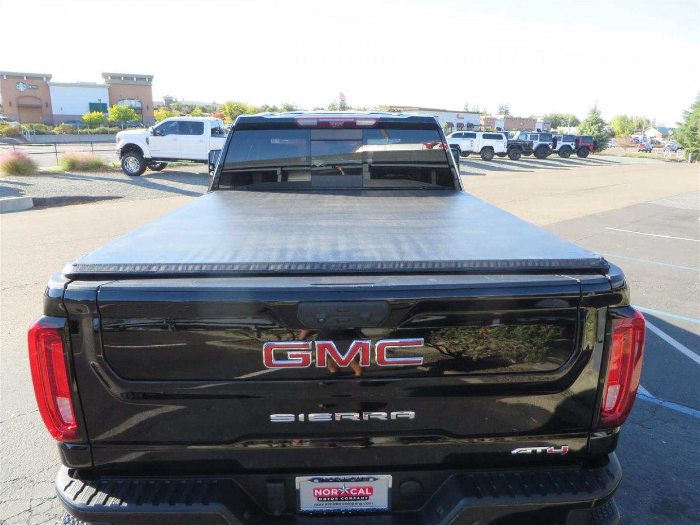 2021 BLACK /BLACK GMC Sierra 2500HD AT4 Crew Cab 4WD (1GT49PEY3MF) with an 6.6L V8 OHV 16 DIESEL engine, 6A transmission, located at 2630 Grass Valley Highway, Auburn, CA, 95603, (530) 508-5100, 38.937893, -121.095482 - Features a RC 7'' suspension system, 37'' Nitto Ridge Grappler tires, 22'' 4 Play wheels, Airlift helper bags with compressor, soft folding tonneau cover, and window tint. - Photo#13