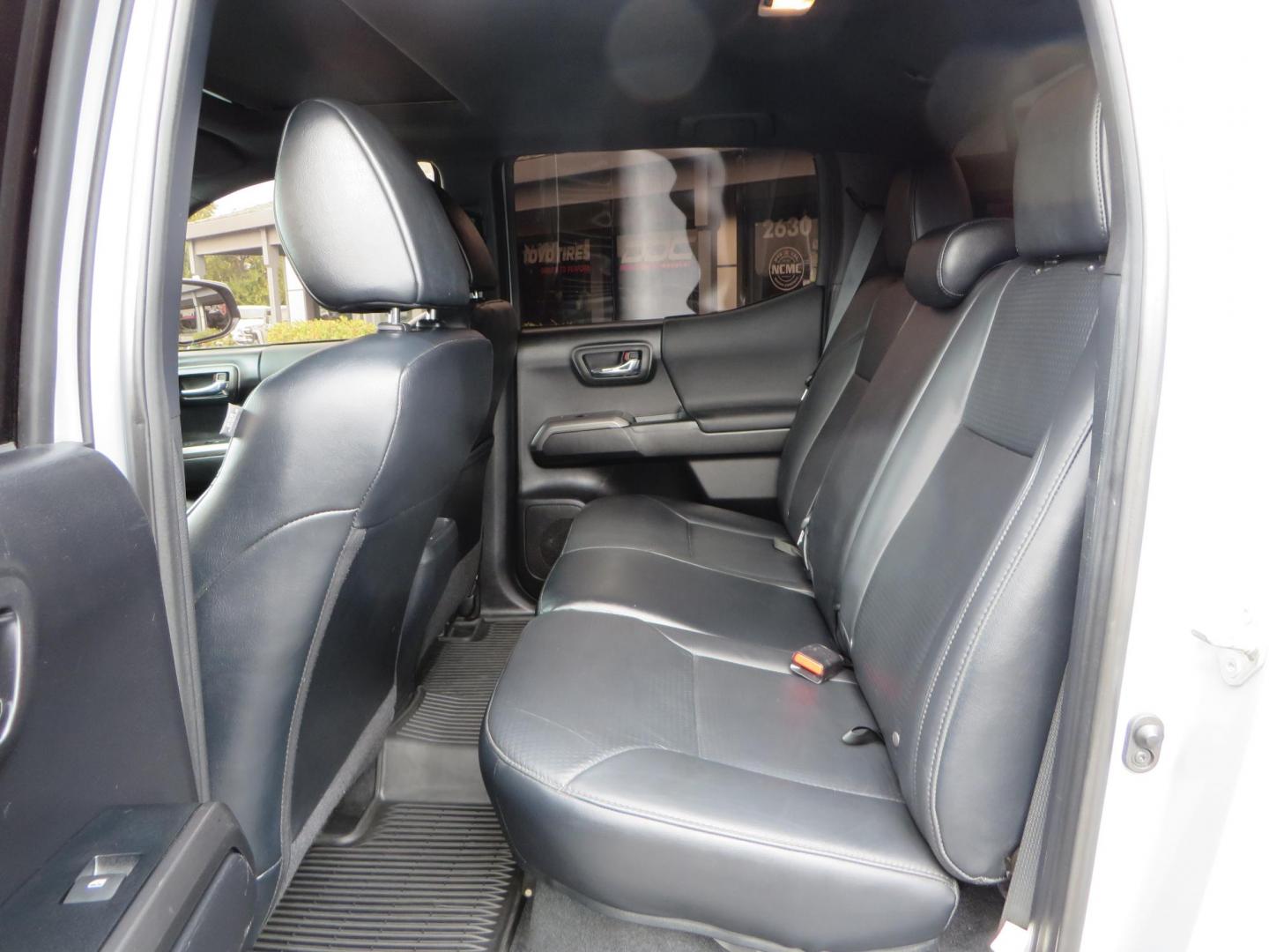 2019 grey /black Toyota Tacoma TRD Sport Double Cab (3TMCZ5AN2KM) with an 3.6L V6 DOHC 24V engine, 6A transmission, located at 2630 Grass Valley Highway, Auburn, CA, 95603, (530) 508-5100, 38.937893, -121.095482 - Must see Tacoma sitting on King 2.5 adjustable remote reservoir coilovers, King 2.5 adjustable remote reservoir rear shocks, Icon Upper control arms, BFG KO3 tires, 17" Method NV wheels, C4 front bumper, Baja Designs lights, LUXX series taillights, aluminum TRD skid plate, bedmat, bed extender, and - Photo#49
