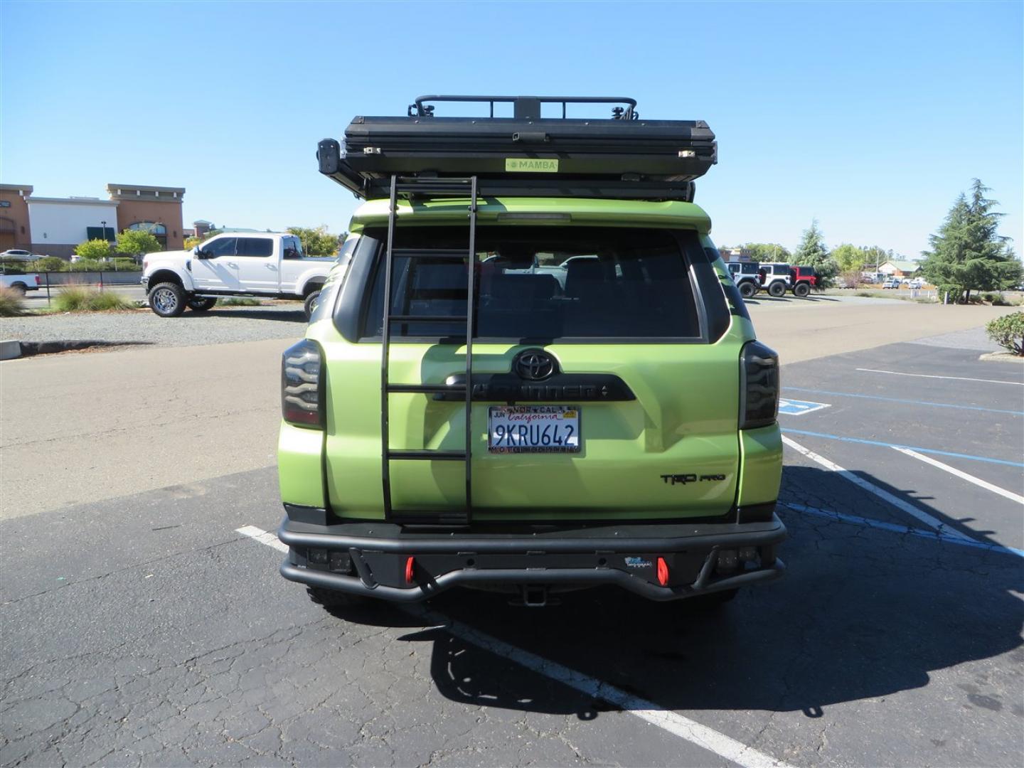2022 Green /Black Toyota 4Runner TRD PRO 4WD (JTELU5JR6N6) with an 4.0L V6 DOHC 24V engine, 5A transmission, located at 2630 Grass Valley Highway, Auburn, CA, 95603, (530) 508-5100, 38.937893, -121.095482 - Features- A Magnuson Supercharger, Westcott Designs level kit and Roof Ladder, BFG KO3 tires, IronMan Front and rear bumpers, Winch, Led lighting, Rock Sliders, Alpha Rex tail lights, IKamper roof rack, Mamba Roof mounted tent, Yakima roof basket, Kammok Awning, Smoked bug deflector, Pedal Commander - Photo#3