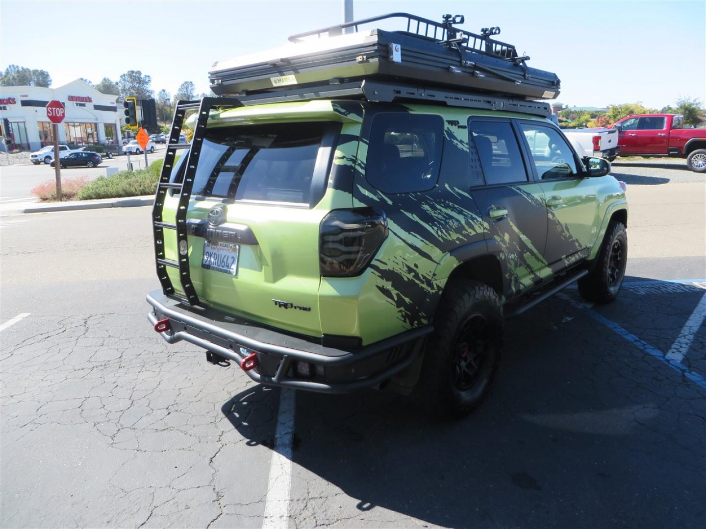 2022 Green /Black Toyota 4Runner TRD PRO 4WD (JTELU5JR6N6) with an 4.0L V6 DOHC 24V engine, 5A transmission, located at 2630 Grass Valley Highway, Auburn, CA, 95603, (530) 508-5100, 38.937893, -121.095482 - Features- A Magnuson Supercharger, Westcott Designs level kit and Roof Ladder, BFG KO3 tires, IronMan Front and rear bumpers, Winch, Led lighting, Rock Sliders, Alpha Rex tail lights, IKamper roof rack, Mamba Roof mounted tent, Yakima roof basket, Kammok Awning, Smoked bug deflector, Pedal Commander - Photo#4
