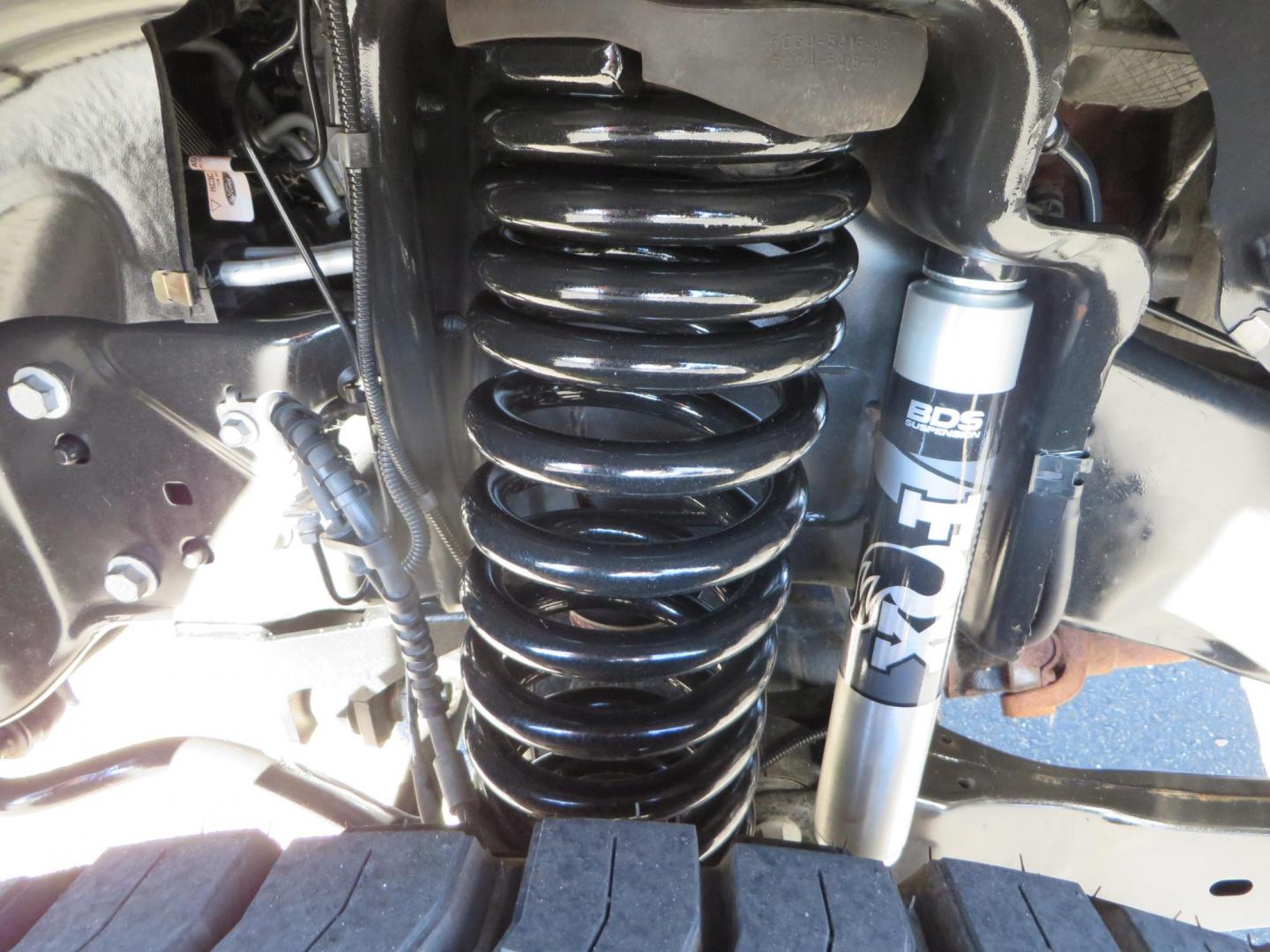 2021 White /BLACK Ford F-250 SD Lariat Crew Cab 4WD (1FT7W2BTXME) with an 6.7L V8 OHV 16V DIESEL engine, 6A transmission, located at 2630 Grass Valley Highway, Auburn, CA, 95603, (530) 508-5100, 38.937893, -121.095482 - Features a BDS level kit with Fox 2.0 shocks, 35" Toyo Open Country RT trail tires, 18" KMC IMS wheels, Weathertech Bug deflector and floor liners. - Photo#10