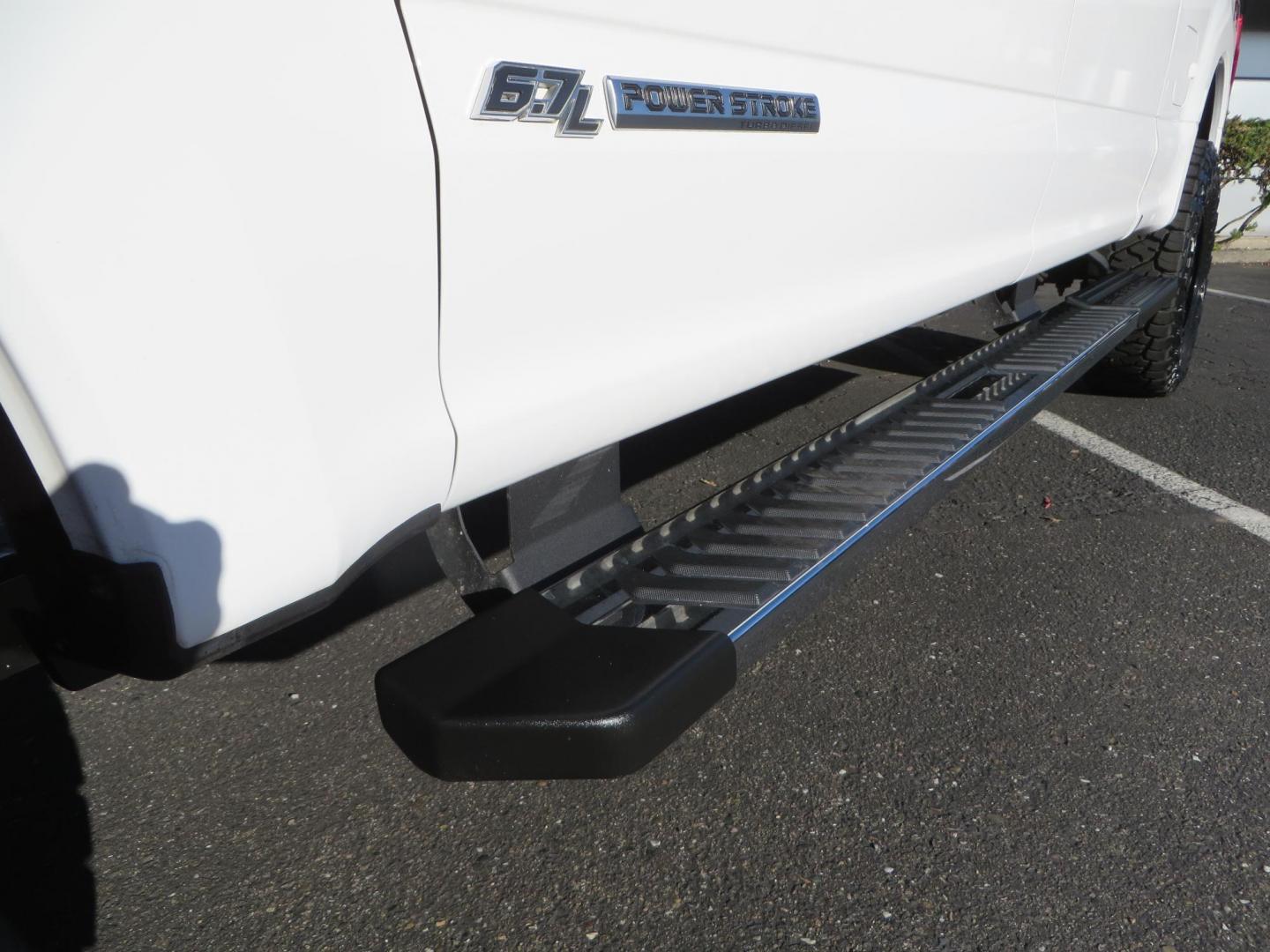 2021 White /BLACK Ford F-250 SD Lariat Crew Cab 4WD (1FT7W2BTXME) with an 6.7L V8 OHV 16V DIESEL engine, 6A transmission, located at 2630 Grass Valley Highway, Auburn, CA, 95603, (530) 508-5100, 38.937893, -121.095482 - Features a BDS level kit with Fox 2.0 shocks, 35" Toyo Open Country RT trail tires, 18" KMC IMS wheels, Weathertech Bug deflector and floor liners. - Photo#11