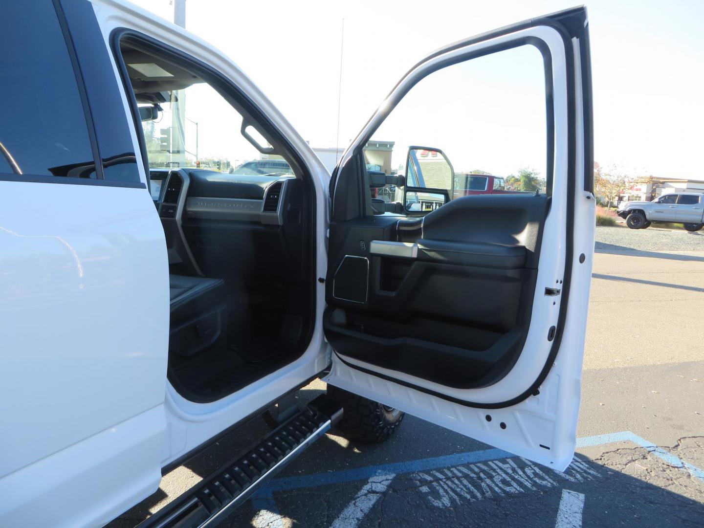 2021 White /BLACK Ford F-250 SD Lariat Crew Cab 4WD (1FT7W2BTXME) with an 6.7L V8 OHV 16V DIESEL engine, 6A transmission, located at 2630 Grass Valley Highway, Auburn, CA, 95603, (530) 508-5100, 38.937893, -121.095482 - Features a BDS level kit with Fox 2.0 shocks, 35" Toyo Open Country RT trail tires, 18" KMC IMS wheels, Weathertech Bug deflector and floor liners. - Photo#49