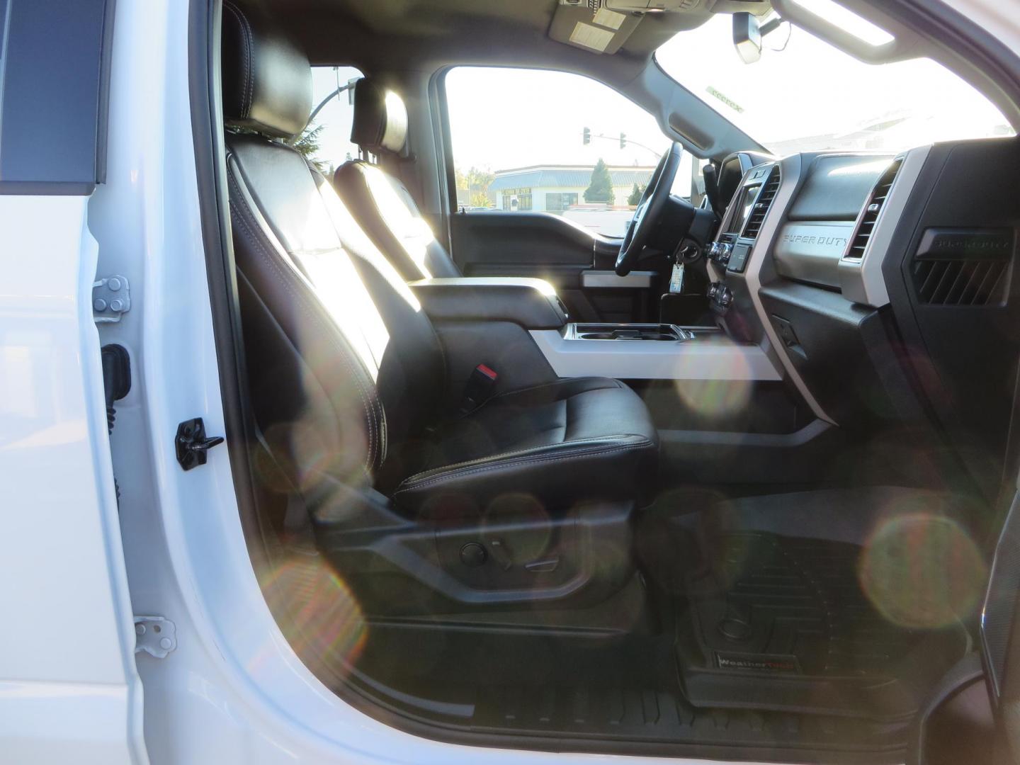 2021 White /BLACK Ford F-250 SD Lariat Crew Cab 4WD (1FT7W2BTXME) with an 6.7L V8 OHV 16V DIESEL engine, 6A transmission, located at 2630 Grass Valley Highway, Auburn, CA, 95603, (530) 508-5100, 38.937893, -121.095482 - Features a BDS level kit with Fox 2.0 shocks, 35" Toyo Open Country RT trail tires, 18" KMC IMS wheels, Weathertech Bug deflector and floor liners. - Photo#52