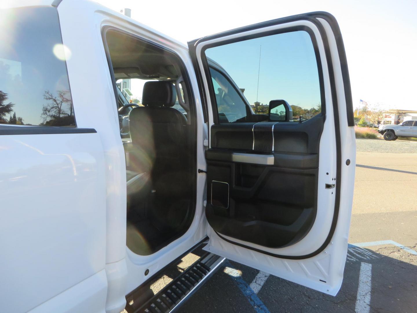 2021 White /BLACK Ford F-250 SD Lariat Crew Cab 4WD (1FT7W2BTXME) with an 6.7L V8 OHV 16V DIESEL engine, 6A transmission, located at 2630 Grass Valley Highway, Auburn, CA, 95603, (530) 508-5100, 38.937893, -121.095482 - Features a BDS level kit with Fox 2.0 shocks, 35" Toyo Open Country RT trail tires, 18" KMC IMS wheels, Weathertech Bug deflector and floor liners. - Photo#57