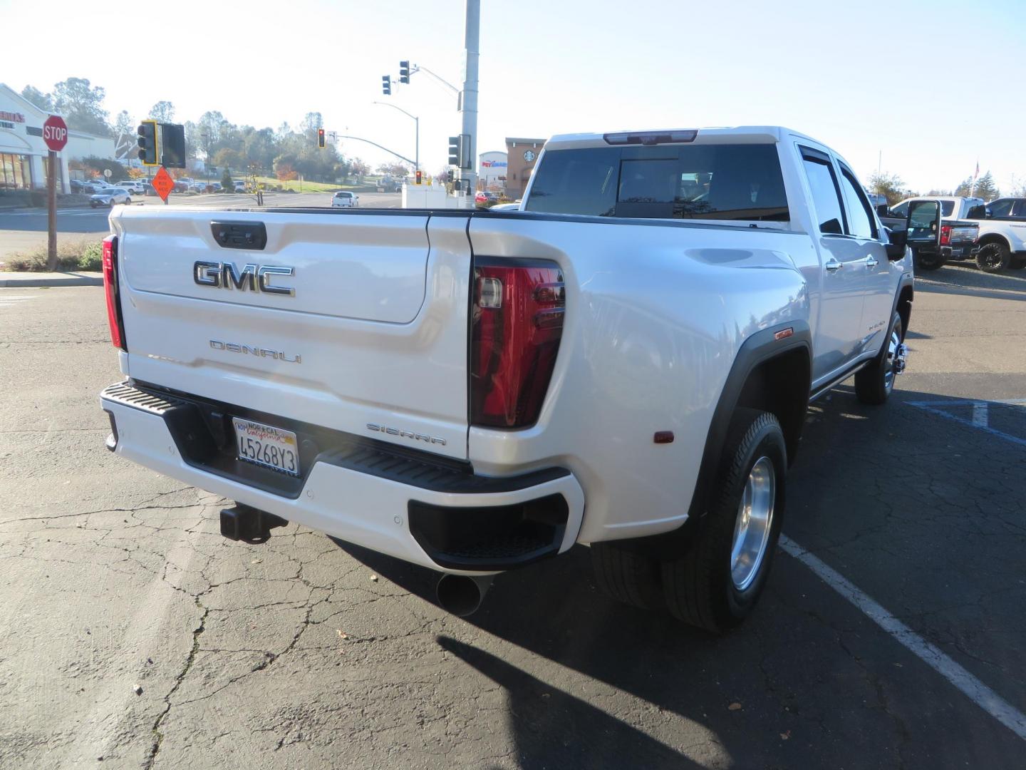 2024 White /Brown GMC Sierra 3500HD Crew Cab 4WD (1GT49YEYXRF) with an 6.6L V8 OHV 16V TURBO DIESEL engine, 10 Speed Automatic transmission, located at 2630 Grass Valley Highway, Auburn, CA, 95603, (530) 508-5100, 38.937893, -121.095482 - Must see Tow rig! - Photo#4