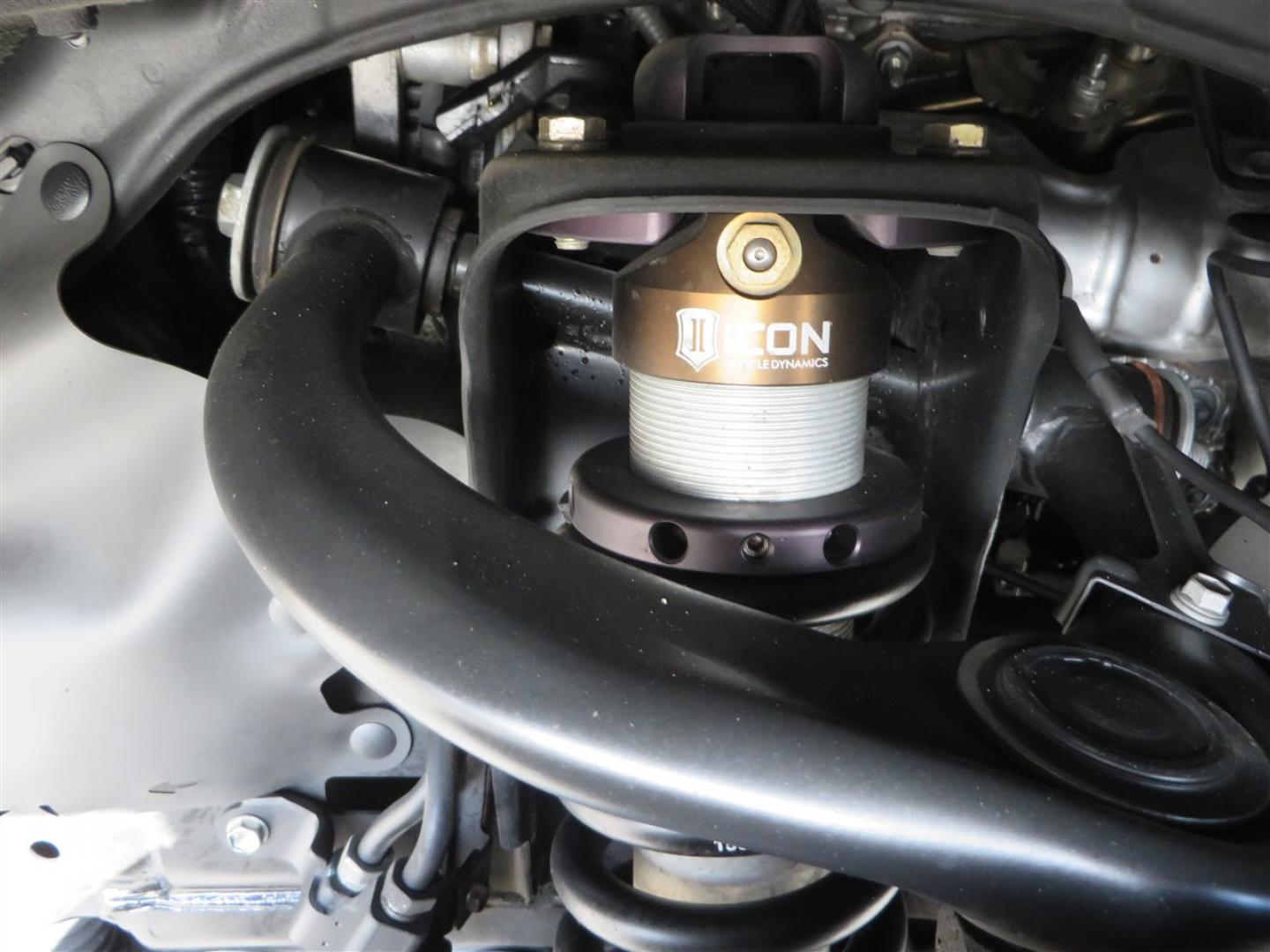 2021 grey /black Toyota 4Runner TRD Off-road Premium 4WD (JTERU5JR3M5) with an 4.0L V6 DOHC 24V engine, 5A transmission, located at 2630 Grass Valley Highway, Auburn, CA, 95603, (530) 508-5100, 38.937893, -121.095482 - Featuring Icon suspension, C4 front bumper, Victory 4x4 rear bumper with spare tire carrier, C4 ladder, Victory 4x4 roof rack, Victory 4x4 rock sliders, Baja designs LED's, 17'' KMC wheels, Maxxis Razr AT tires, and a Victory 4x4 rear cargo Molle panel. - Photo#10