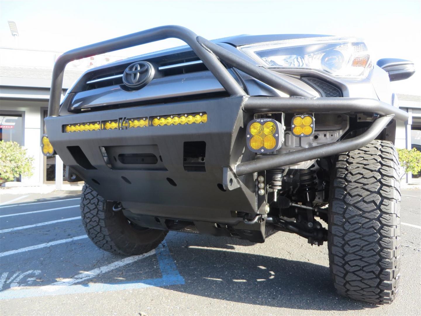 2021 grey /black Toyota 4Runner TRD Off-road Premium 4WD (JTERU5JR3M5) with an 4.0L V6 DOHC 24V engine, 5A transmission, located at 2630 Grass Valley Highway, Auburn, CA, 95603, (530) 508-5100, 38.937893, -121.095482 - Featuring Icon suspension, C4 front bumper, Victory 4x4 rear bumper with spare tire carrier, C4 ladder, Victory 4x4 roof rack, Victory 4x4 rock sliders, Baja designs LED's, 17'' KMC wheels, Maxxis Razr AT tires, and a Victory 4x4 rear cargo Molle panel. - Photo#12