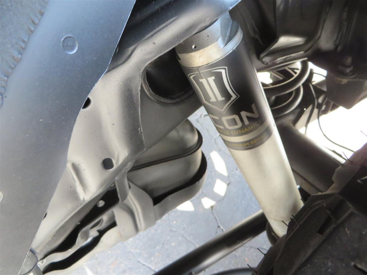 2021 grey /black Toyota 4Runner TRD Off-road Premium 4WD (JTERU5JR3M5) with an 4.0L V6 DOHC 24V engine, 5A transmission, located at 2630 Grass Valley Highway, Auburn, CA, 95603, (530) 508-5100, 38.937893, -121.095482 - Featuring Icon suspension, C4 front bumper, Victory 4x4 rear bumper with spare tire carrier, C4 ladder, Victory 4x4 roof rack, Victory 4x4 rock sliders, Baja designs LED's, 17'' KMC wheels, Maxxis Razr AT tires, and a Victory 4x4 rear cargo Molle panel. - Photo#15