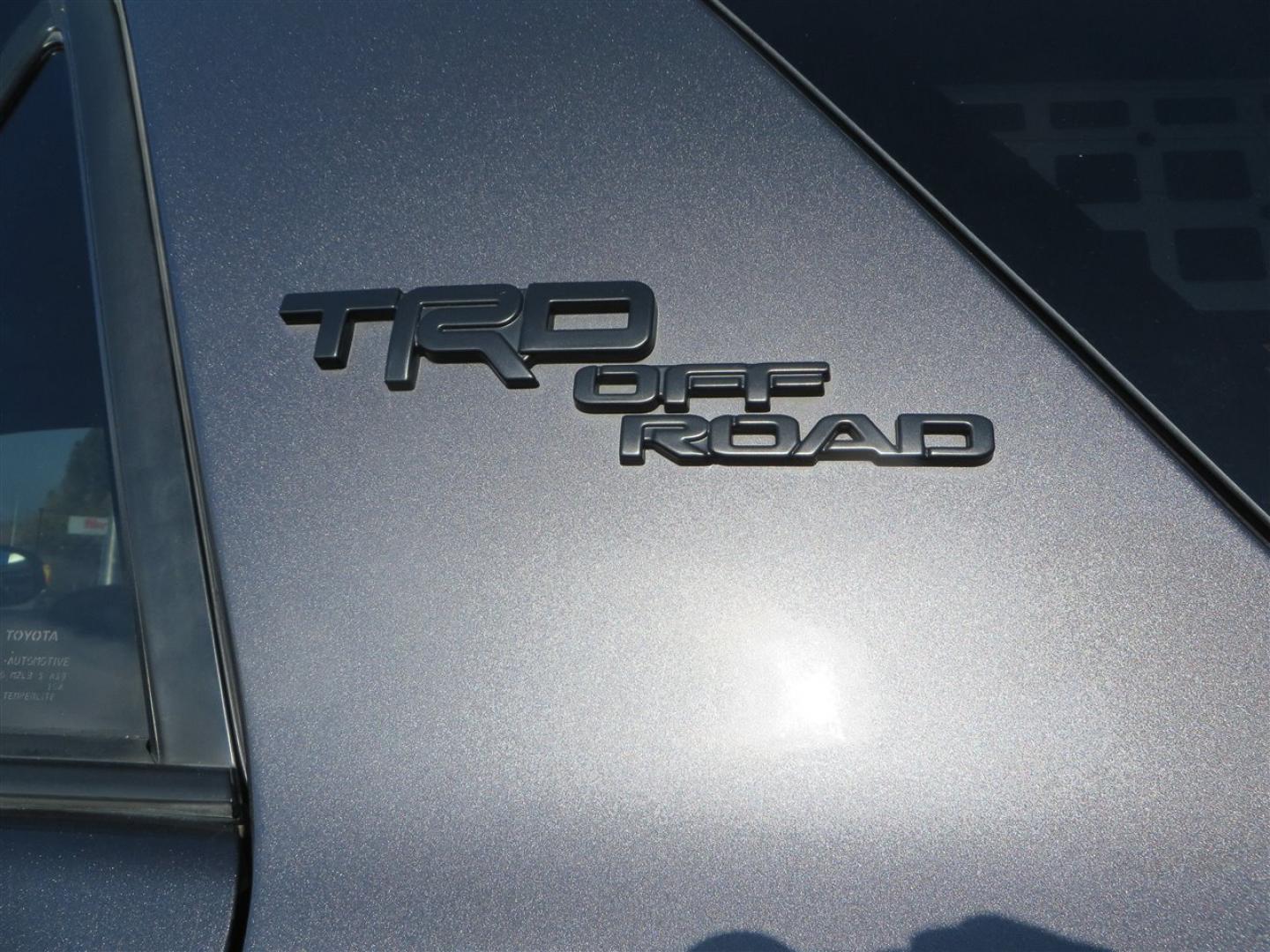 2021 grey /black Toyota 4Runner TRD Off-road Premium 4WD (JTERU5JR3M5) with an 4.0L V6 DOHC 24V engine, 5A transmission, located at 2630 Grass Valley Highway, Auburn, CA, 95603, (530) 508-5100, 38.937893, -121.095482 - Featuring Icon suspension, C4 front bumper, Victory 4x4 rear bumper with spare tire carrier, C4 ladder, Victory 4x4 roof rack, Victory 4x4 rock sliders, Baja designs LED's, 17'' KMC wheels, Maxxis Razr AT tires, and a Victory 4x4 rear cargo Molle panel. - Photo#21