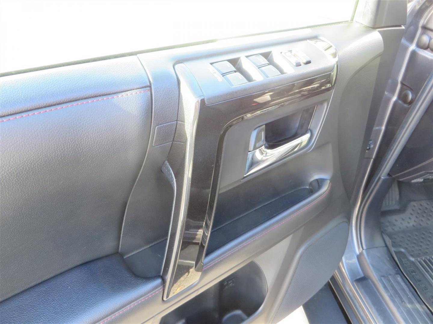 2021 grey /black Toyota 4Runner TRD Off-road Premium 4WD (JTERU5JR3M5) with an 4.0L V6 DOHC 24V engine, 5A transmission, located at 2630 Grass Valley Highway, Auburn, CA, 95603, (530) 508-5100, 38.937893, -121.095482 - Featuring Icon suspension, C4 front bumper, Victory 4x4 rear bumper with spare tire carrier, C4 ladder, Victory 4x4 roof rack, Victory 4x4 rock sliders, Baja designs LED's, 17'' KMC wheels, Maxxis Razr AT tires, and a Victory 4x4 rear cargo Molle panel. - Photo#24