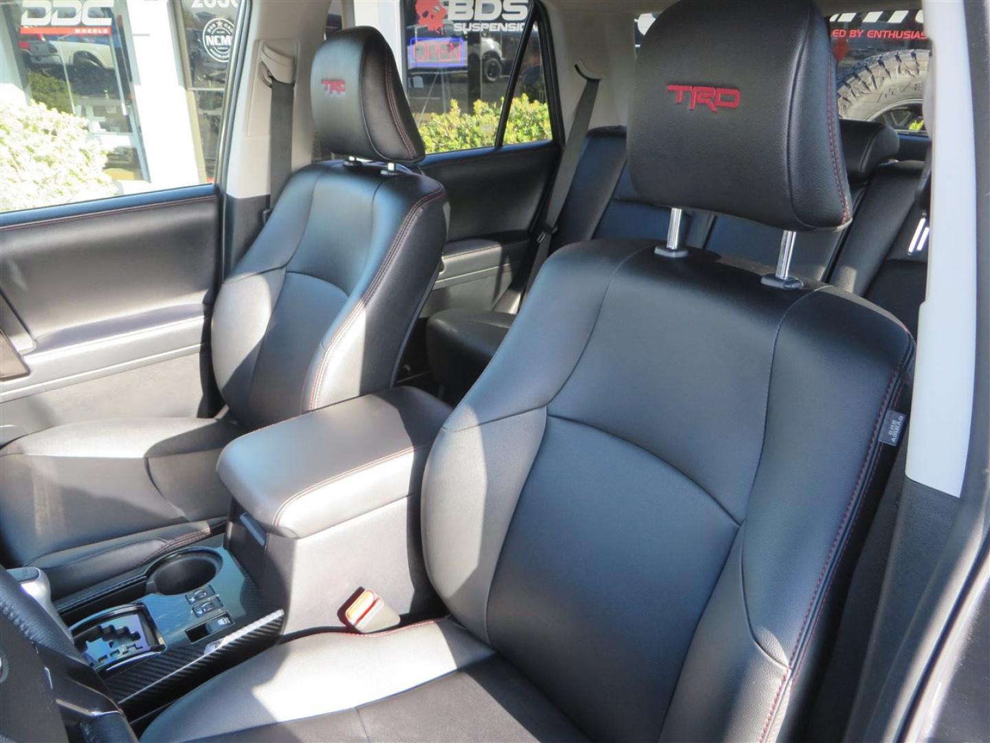 2021 grey /black Toyota 4Runner TRD Off-road Premium 4WD (JTERU5JR3M5) with an 4.0L V6 DOHC 24V engine, 5A transmission, located at 2630 Grass Valley Highway, Auburn, CA, 95603, (530) 508-5100, 38.937893, -121.095482 - Featuring Icon suspension, C4 front bumper, Victory 4x4 rear bumper with spare tire carrier, C4 ladder, Victory 4x4 roof rack, Victory 4x4 rock sliders, Baja designs LED's, 17'' KMC wheels, Maxxis Razr AT tires, and a Victory 4x4 rear cargo Molle panel. - Photo#26