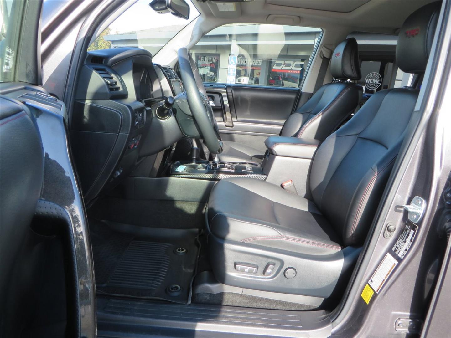 2021 grey /black Toyota 4Runner TRD Off-road Premium 4WD (JTERU5JR3M5) with an 4.0L V6 DOHC 24V engine, 5A transmission, located at 2630 Grass Valley Highway, Auburn, CA, 95603, (530) 508-5100, 38.937893, -121.095482 - Featuring Icon suspension, C4 front bumper, Victory 4x4 rear bumper with spare tire carrier, C4 ladder, Victory 4x4 roof rack, Victory 4x4 rock sliders, Baja designs LED's, 17'' KMC wheels, Maxxis Razr AT tires, and a Victory 4x4 rear cargo Molle panel. - Photo#25