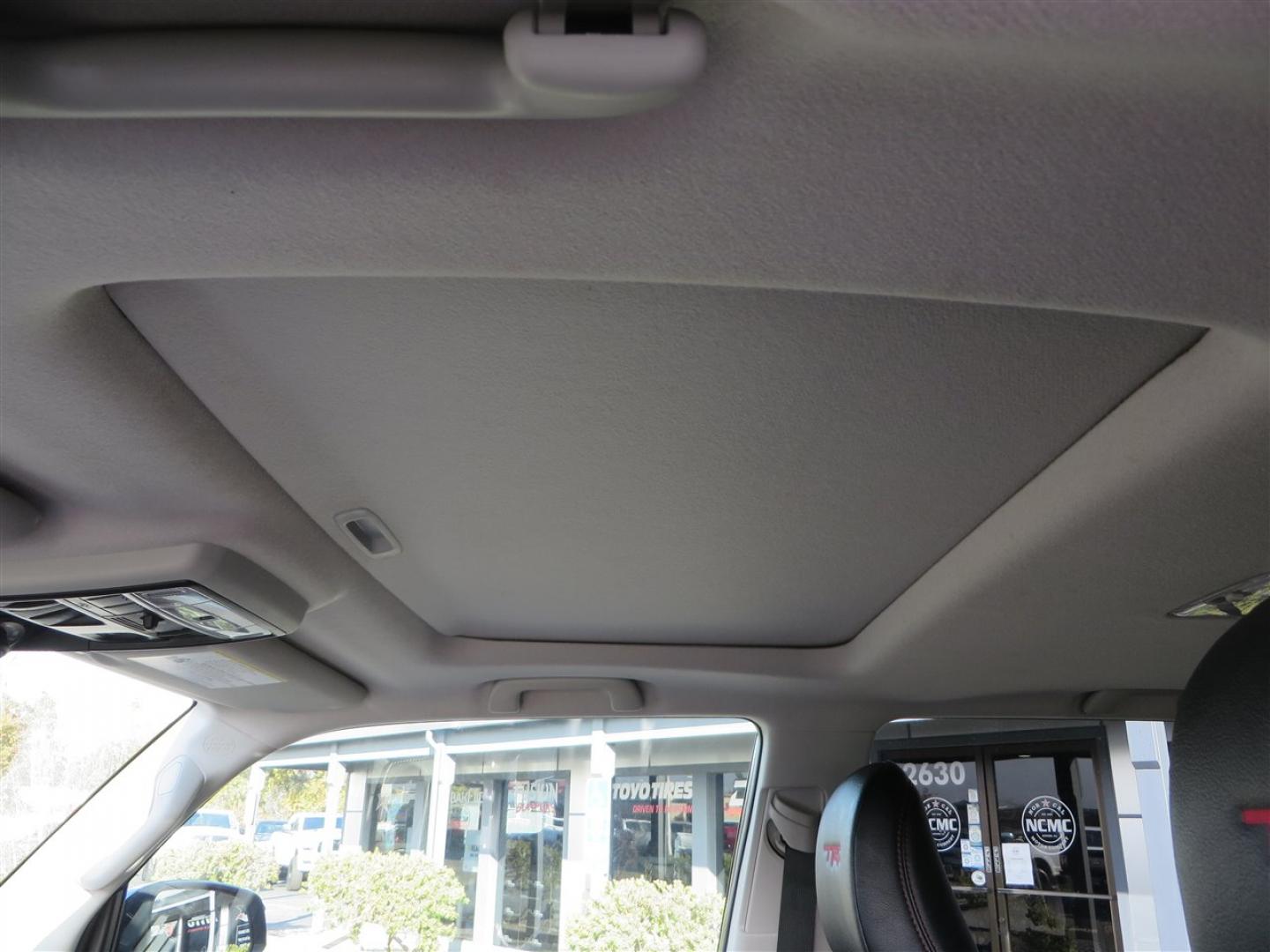 2021 grey /black Toyota 4Runner TRD Off-road Premium 4WD (JTERU5JR3M5) with an 4.0L V6 DOHC 24V engine, 5A transmission, located at 2630 Grass Valley Highway, Auburn, CA, 95603, (530) 508-5100, 38.937893, -121.095482 - Featuring Icon suspension, C4 front bumper, Victory 4x4 rear bumper with spare tire carrier, C4 ladder, Victory 4x4 roof rack, Victory 4x4 rock sliders, Baja designs LED's, 17'' KMC wheels, Maxxis Razr AT tires, and a Victory 4x4 rear cargo Molle panel. - Photo#30