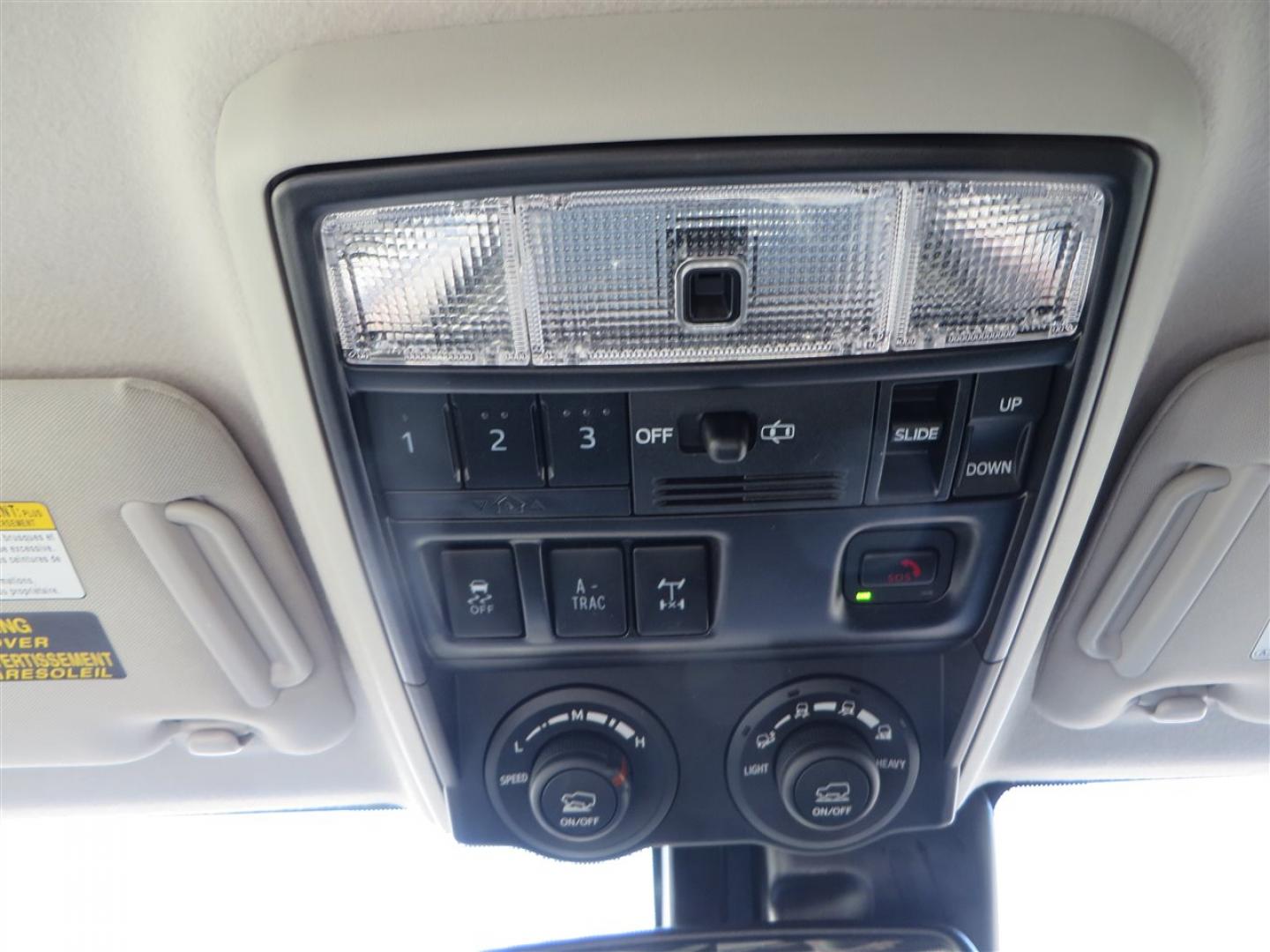 2021 grey /black Toyota 4Runner TRD Off-road Premium 4WD (JTERU5JR3M5) with an 4.0L V6 DOHC 24V engine, 5A transmission, located at 2630 Grass Valley Highway, Auburn, CA, 95603, (530) 508-5100, 38.937893, -121.095482 - Featuring Icon suspension, C4 front bumper, Victory 4x4 rear bumper with spare tire carrier, C4 ladder, Victory 4x4 roof rack, Victory 4x4 rock sliders, Baja designs LED's, 17'' KMC wheels, Maxxis Razr AT tires, and a Victory 4x4 rear cargo Molle panel. - Photo#31