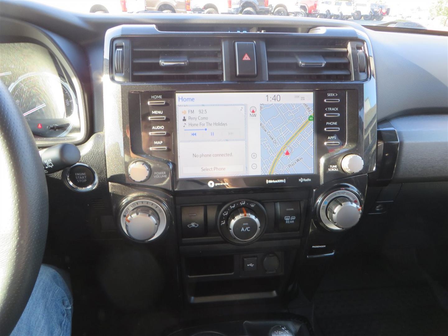 2021 grey /black Toyota 4Runner TRD Off-road Premium 4WD (JTERU5JR3M5) with an 4.0L V6 DOHC 24V engine, 5A transmission, located at 2630 Grass Valley Highway, Auburn, CA, 95603, (530) 508-5100, 38.937893, -121.095482 - Featuring Icon suspension, C4 front bumper, Victory 4x4 rear bumper with spare tire carrier, C4 ladder, Victory 4x4 roof rack, Victory 4x4 rock sliders, Baja designs LED's, 17'' KMC wheels, Maxxis Razr AT tires, and a Victory 4x4 rear cargo Molle panel. - Photo#33