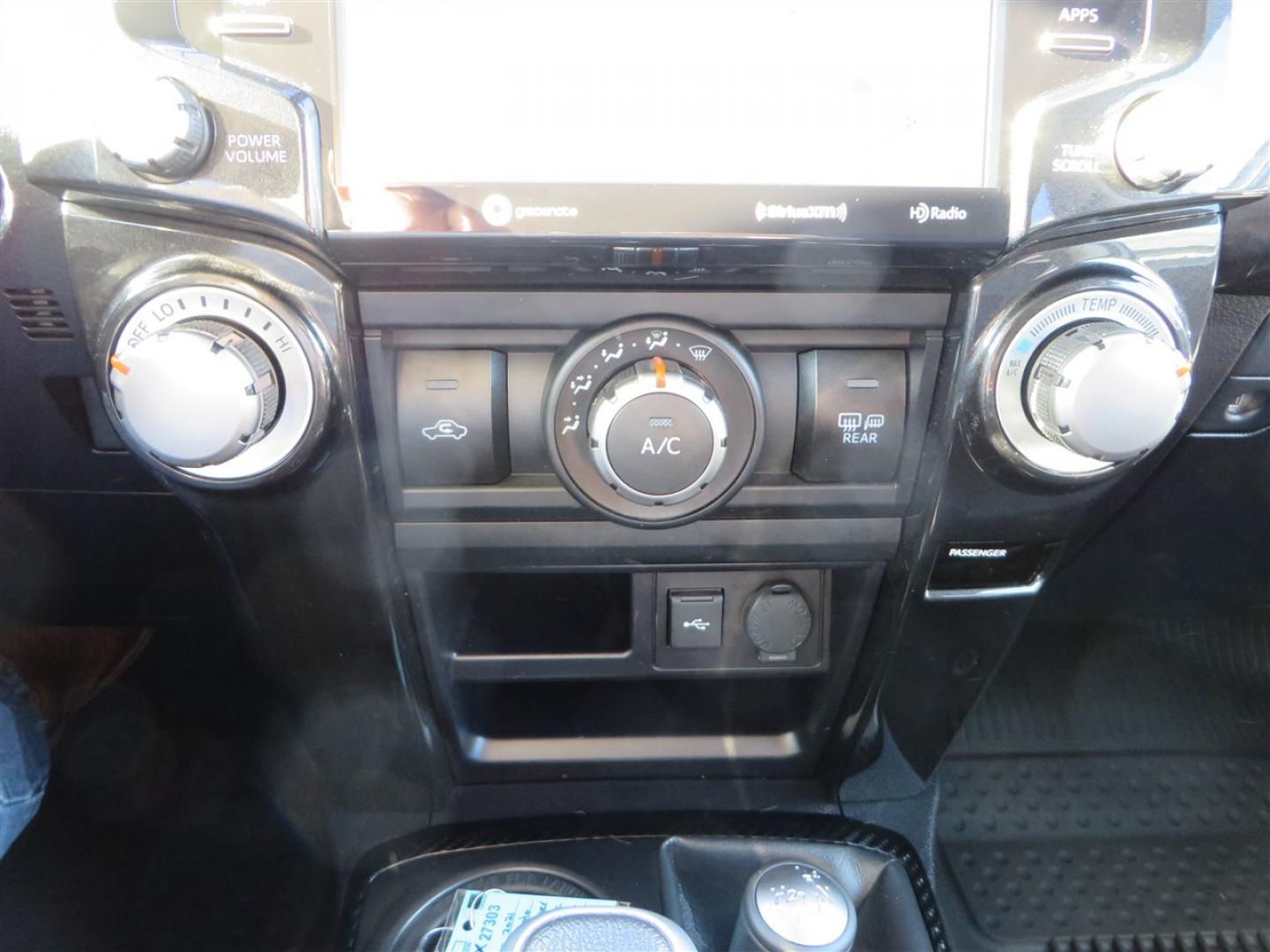 2021 grey /black Toyota 4Runner TRD Off-road Premium 4WD (JTERU5JR3M5) with an 4.0L V6 DOHC 24V engine, 5A transmission, located at 2630 Grass Valley Highway, Auburn, CA, 95603, (530) 508-5100, 38.937893, -121.095482 - Featuring Icon suspension, C4 front bumper, Victory 4x4 rear bumper with spare tire carrier, C4 ladder, Victory 4x4 roof rack, Victory 4x4 rock sliders, Baja designs LED's, 17'' KMC wheels, Maxxis Razr AT tires, and a Victory 4x4 rear cargo Molle panel. - Photo#35