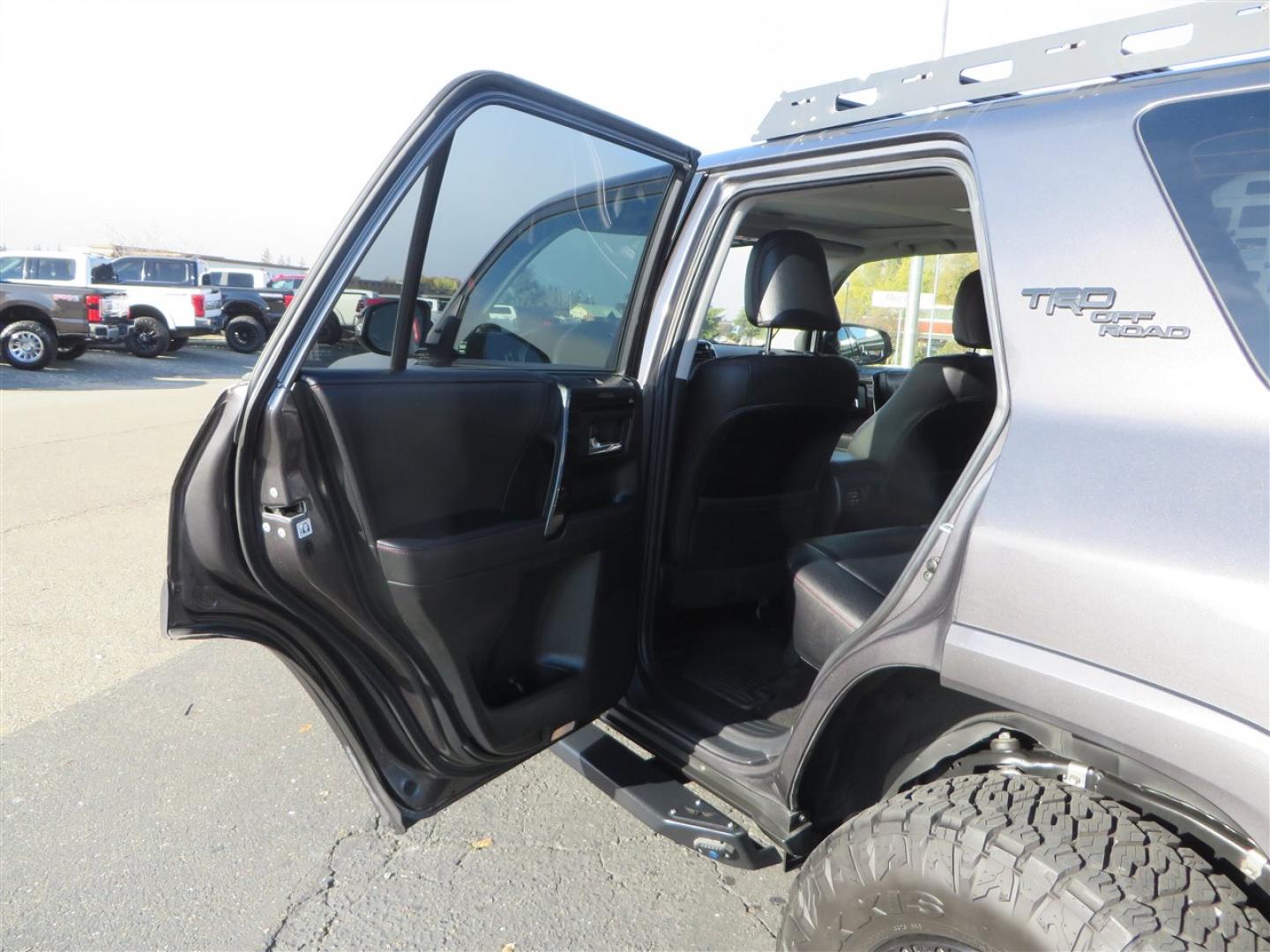 2021 grey /black Toyota 4Runner TRD Off-road Premium 4WD (JTERU5JR3M5) with an 4.0L V6 DOHC 24V engine, 5A transmission, located at 2630 Grass Valley Highway, Auburn, CA, 95603, (530) 508-5100, 38.937893, -121.095482 - Featuring Icon suspension, C4 front bumper, Victory 4x4 rear bumper with spare tire carrier, C4 ladder, Victory 4x4 roof rack, Victory 4x4 rock sliders, Baja designs LED's, 17'' KMC wheels, Maxxis Razr AT tires, and a Victory 4x4 rear cargo Molle panel. - Photo#45