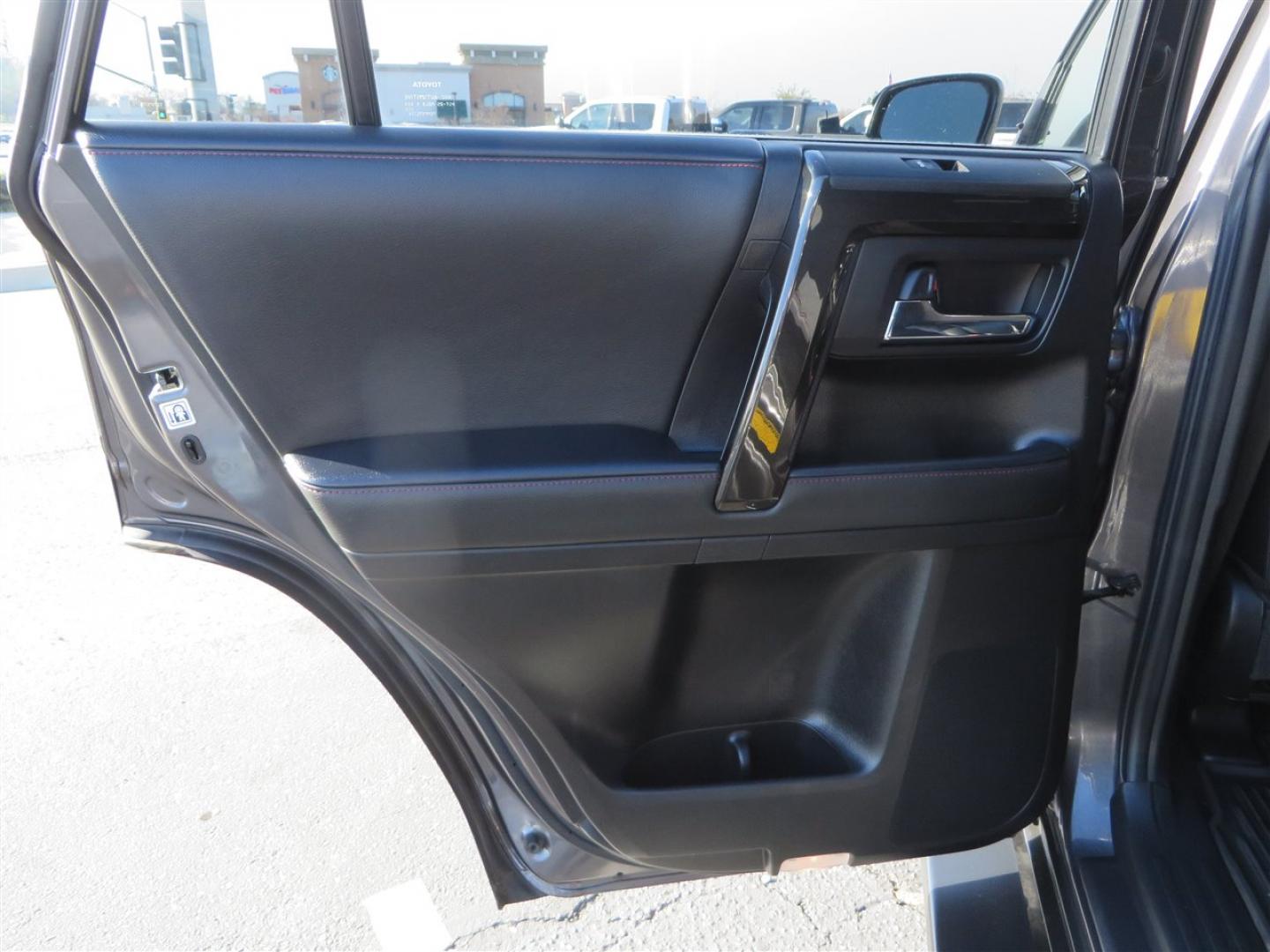 2021 grey /black Toyota 4Runner TRD Off-road Premium 4WD (JTERU5JR3M5) with an 4.0L V6 DOHC 24V engine, 5A transmission, located at 2630 Grass Valley Highway, Auburn, CA, 95603, (530) 508-5100, 38.937893, -121.095482 - Featuring Icon suspension, C4 front bumper, Victory 4x4 rear bumper with spare tire carrier, C4 ladder, Victory 4x4 roof rack, Victory 4x4 rock sliders, Baja designs LED's, 17'' KMC wheels, Maxxis Razr AT tires, and a Victory 4x4 rear cargo Molle panel. - Photo#46