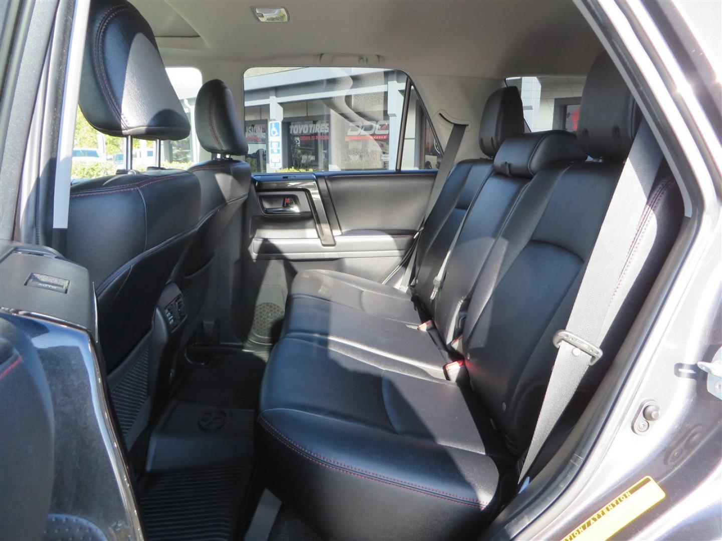 2021 grey /black Toyota 4Runner TRD Off-road Premium 4WD (JTERU5JR3M5) with an 4.0L V6 DOHC 24V engine, 5A transmission, located at 2630 Grass Valley Highway, Auburn, CA, 95603, (530) 508-5100, 38.937893, -121.095482 - Featuring Icon suspension, C4 front bumper, Victory 4x4 rear bumper with spare tire carrier, C4 ladder, Victory 4x4 roof rack, Victory 4x4 rock sliders, Baja designs LED's, 17'' KMC wheels, Maxxis Razr AT tires, and a Victory 4x4 rear cargo Molle panel. - Photo#48