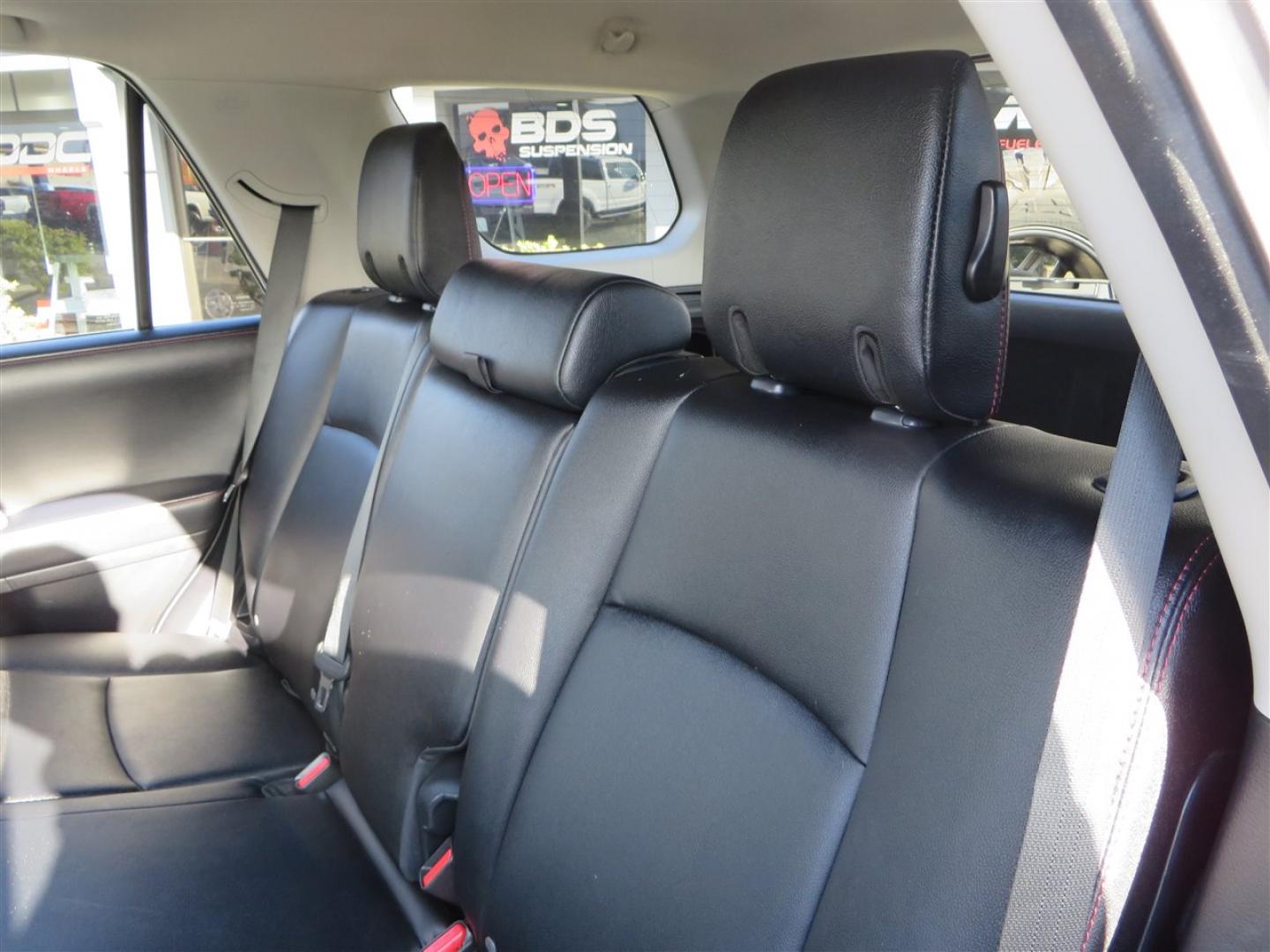 2021 grey /black Toyota 4Runner TRD Off-road Premium 4WD (JTERU5JR3M5) with an 4.0L V6 DOHC 24V engine, 5A transmission, located at 2630 Grass Valley Highway, Auburn, CA, 95603, (530) 508-5100, 38.937893, -121.095482 - Featuring Icon suspension, C4 front bumper, Victory 4x4 rear bumper with spare tire carrier, C4 ladder, Victory 4x4 roof rack, Victory 4x4 rock sliders, Baja designs LED's, 17'' KMC wheels, Maxxis Razr AT tires, and a Victory 4x4 rear cargo Molle panel. - Photo#49