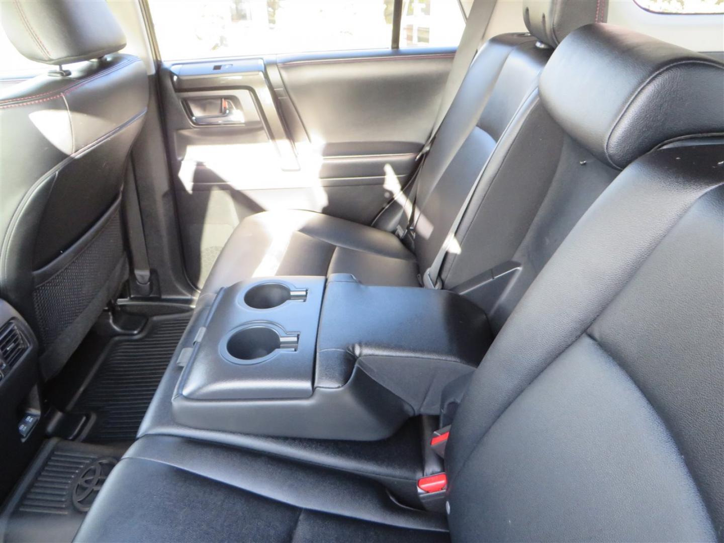 2021 grey /black Toyota 4Runner TRD Off-road Premium 4WD (JTERU5JR3M5) with an 4.0L V6 DOHC 24V engine, 5A transmission, located at 2630 Grass Valley Highway, Auburn, CA, 95603, (530) 508-5100, 38.937893, -121.095482 - Featuring Icon suspension, C4 front bumper, Victory 4x4 rear bumper with spare tire carrier, C4 ladder, Victory 4x4 roof rack, Victory 4x4 rock sliders, Baja designs LED's, 17'' KMC wheels, Maxxis Razr AT tires, and a Victory 4x4 rear cargo Molle panel. - Photo#50