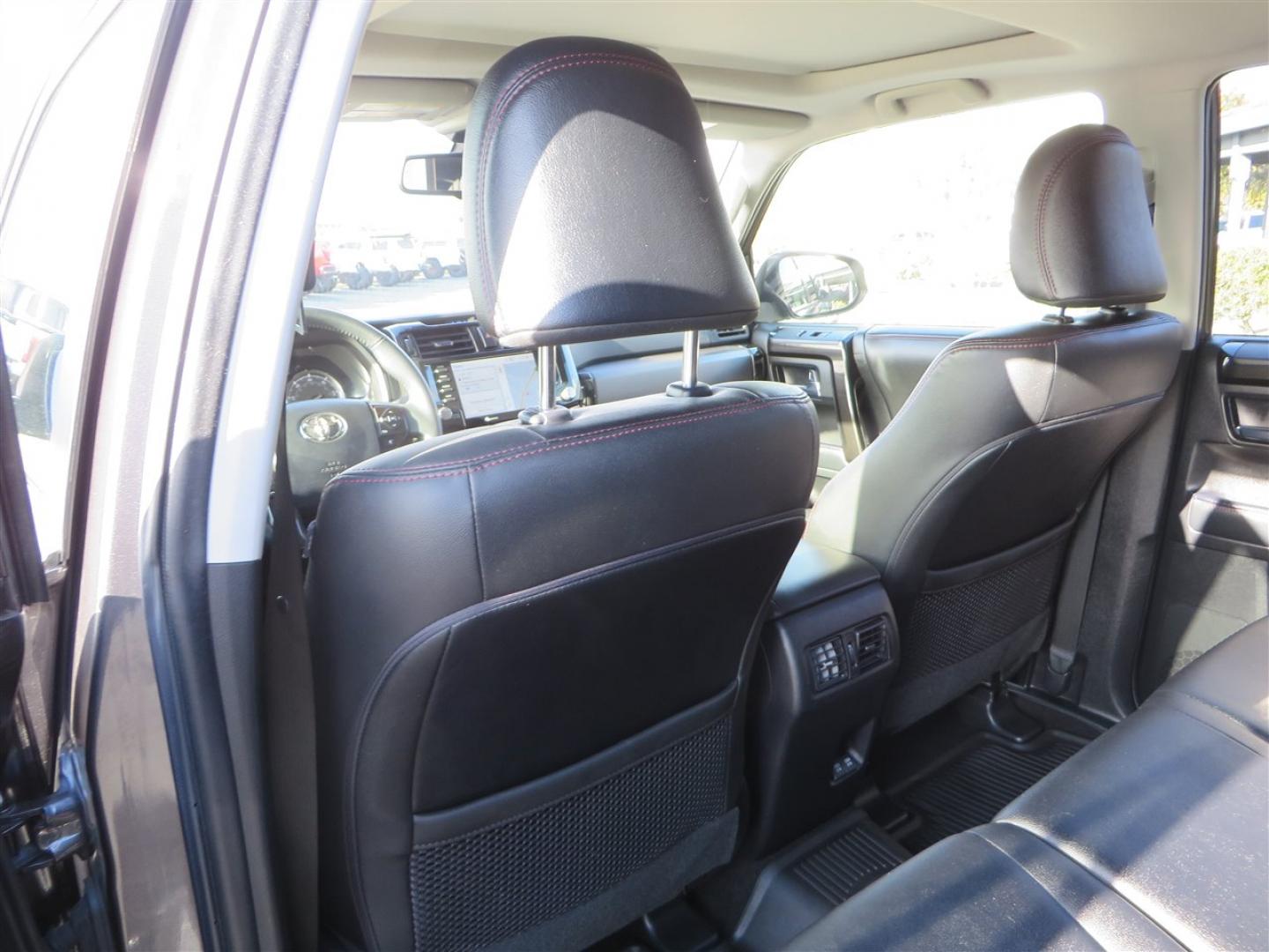 2021 grey /black Toyota 4Runner TRD Off-road Premium 4WD (JTERU5JR3M5) with an 4.0L V6 DOHC 24V engine, 5A transmission, located at 2630 Grass Valley Highway, Auburn, CA, 95603, (530) 508-5100, 38.937893, -121.095482 - Featuring Icon suspension, C4 front bumper, Victory 4x4 rear bumper with spare tire carrier, C4 ladder, Victory 4x4 roof rack, Victory 4x4 rock sliders, Baja designs LED's, 17'' KMC wheels, Maxxis Razr AT tires, and a Victory 4x4 rear cargo Molle panel. - Photo#52