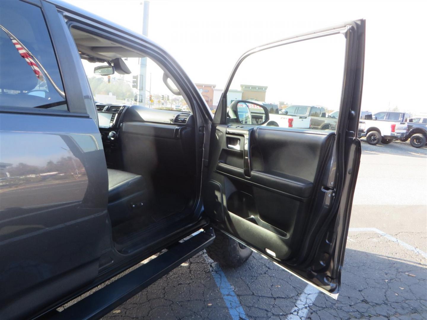 2021 grey /black Toyota 4Runner TRD Off-road Premium 4WD (JTERU5JR3M5) with an 4.0L V6 DOHC 24V engine, 5A transmission, located at 2630 Grass Valley Highway, Auburn, CA, 95603, (530) 508-5100, 38.937893, -121.095482 - Featuring Icon suspension, C4 front bumper, Victory 4x4 rear bumper with spare tire carrier, C4 ladder, Victory 4x4 roof rack, Victory 4x4 rock sliders, Baja designs LED's, 17'' KMC wheels, Maxxis Razr AT tires, and a Victory 4x4 rear cargo Molle panel. - Photo#54